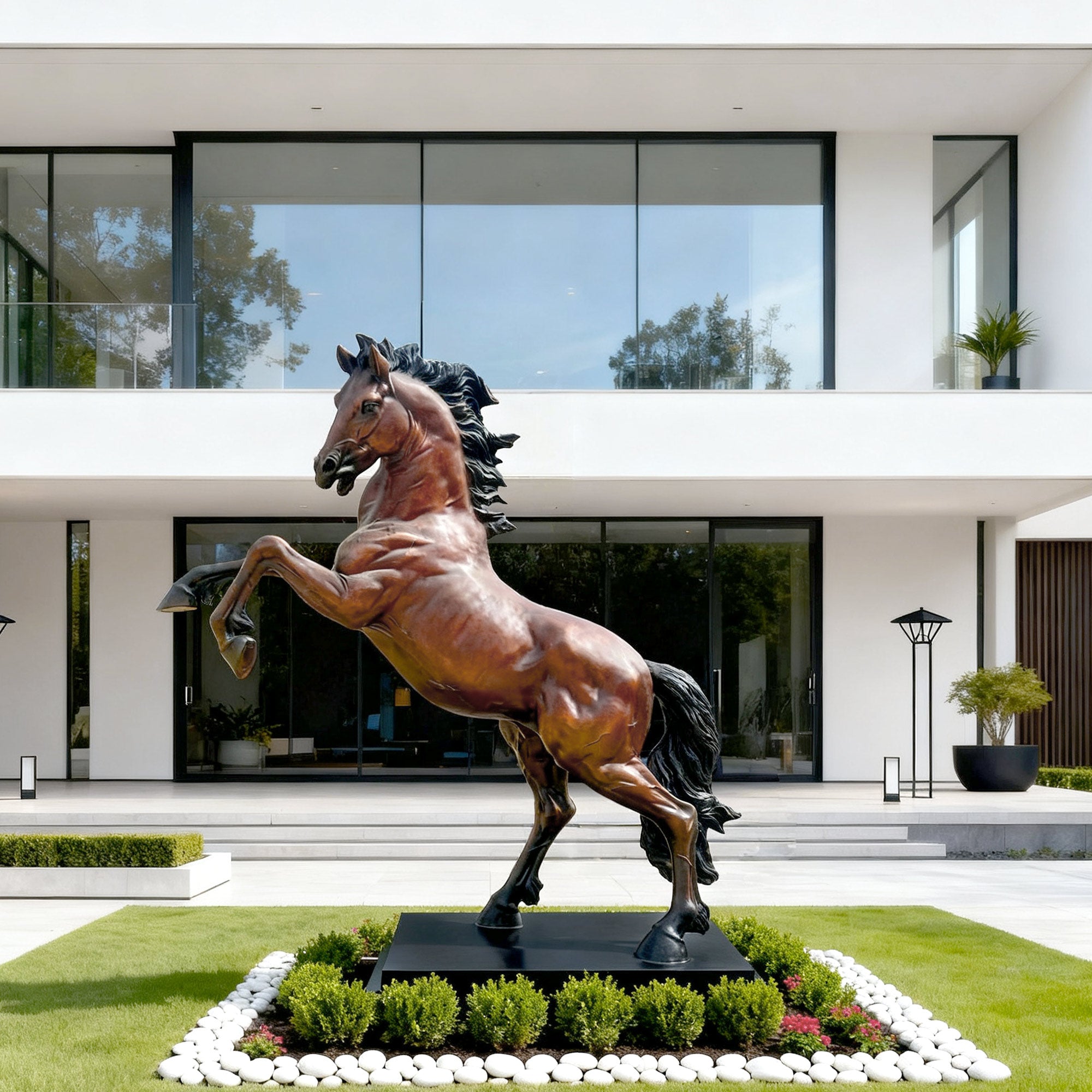 A polished bronze prancing horse sculpture on a pedestal, showcased in a modern, elegant interior