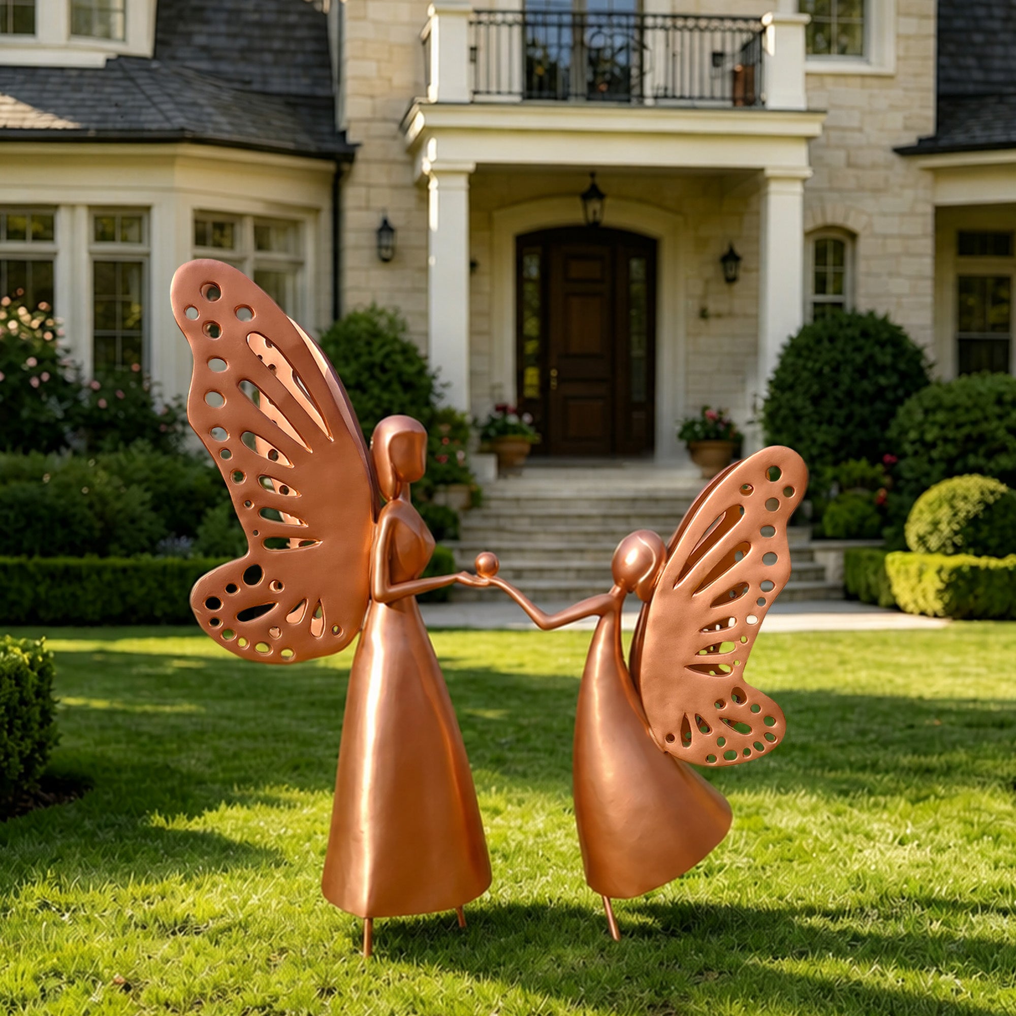 Copper sculpture of a mother and child with butterfly wings, standing together in a garden, symbolizing love and connection
