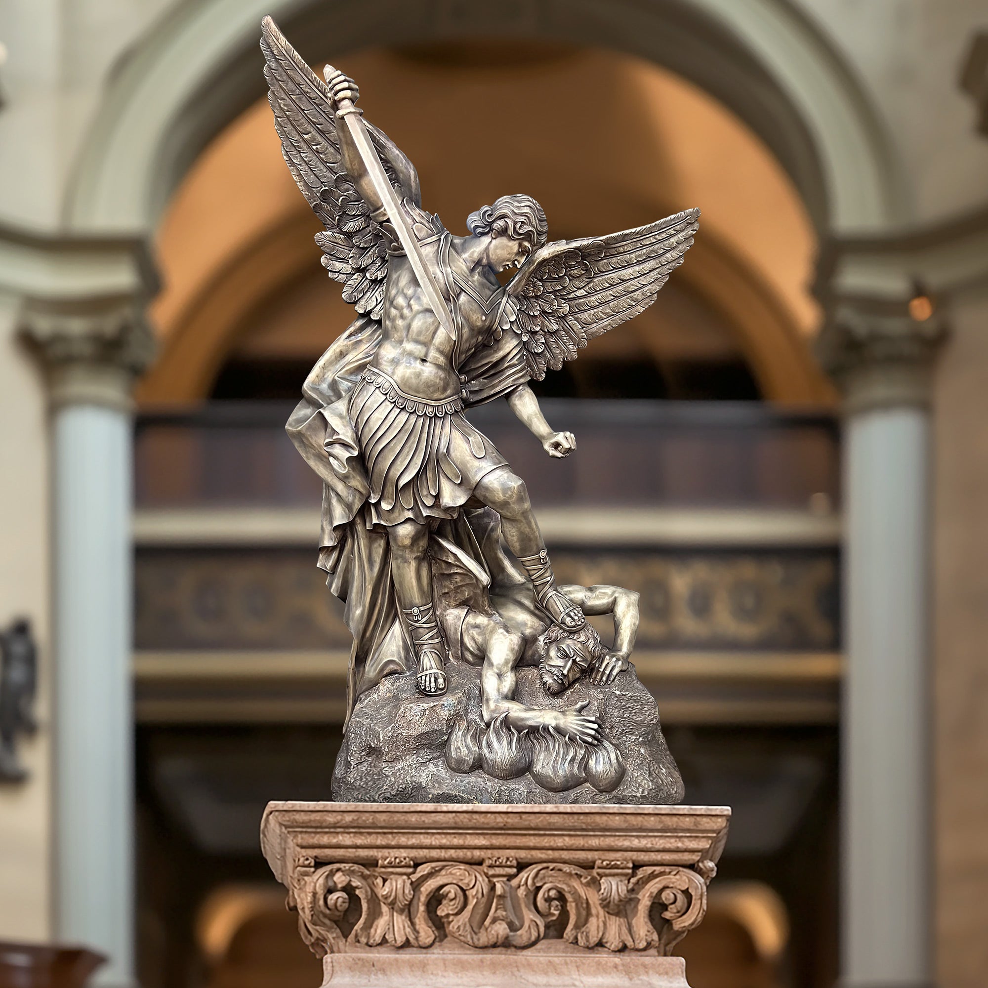 St. Michael the Archangel defender bronze statue with antique bronze finish, display on a high base