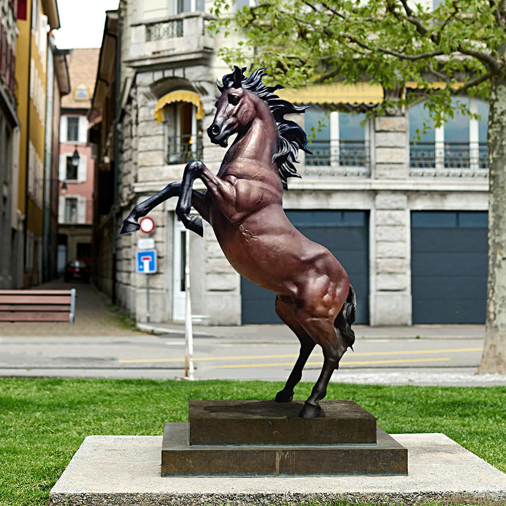 Custom bronze rearing horse sculpture with hand-painted brown and black finish, capturing the power and grace of a majestic horse in motion.