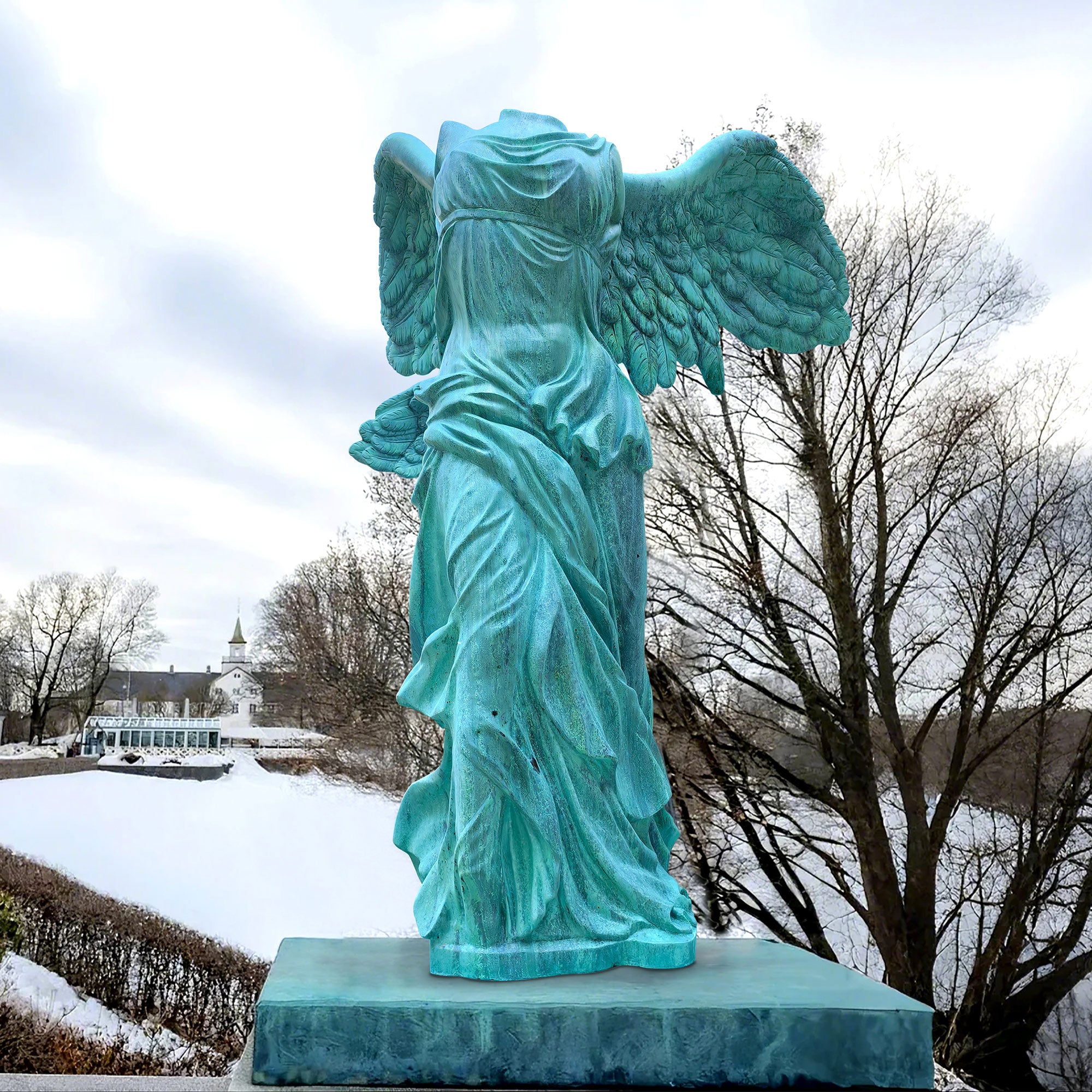 Bronze Winged Nike Victory of Samothrace sculpture with patina green finish, showcasing classical drapery and outstretched wings in outdoor garden