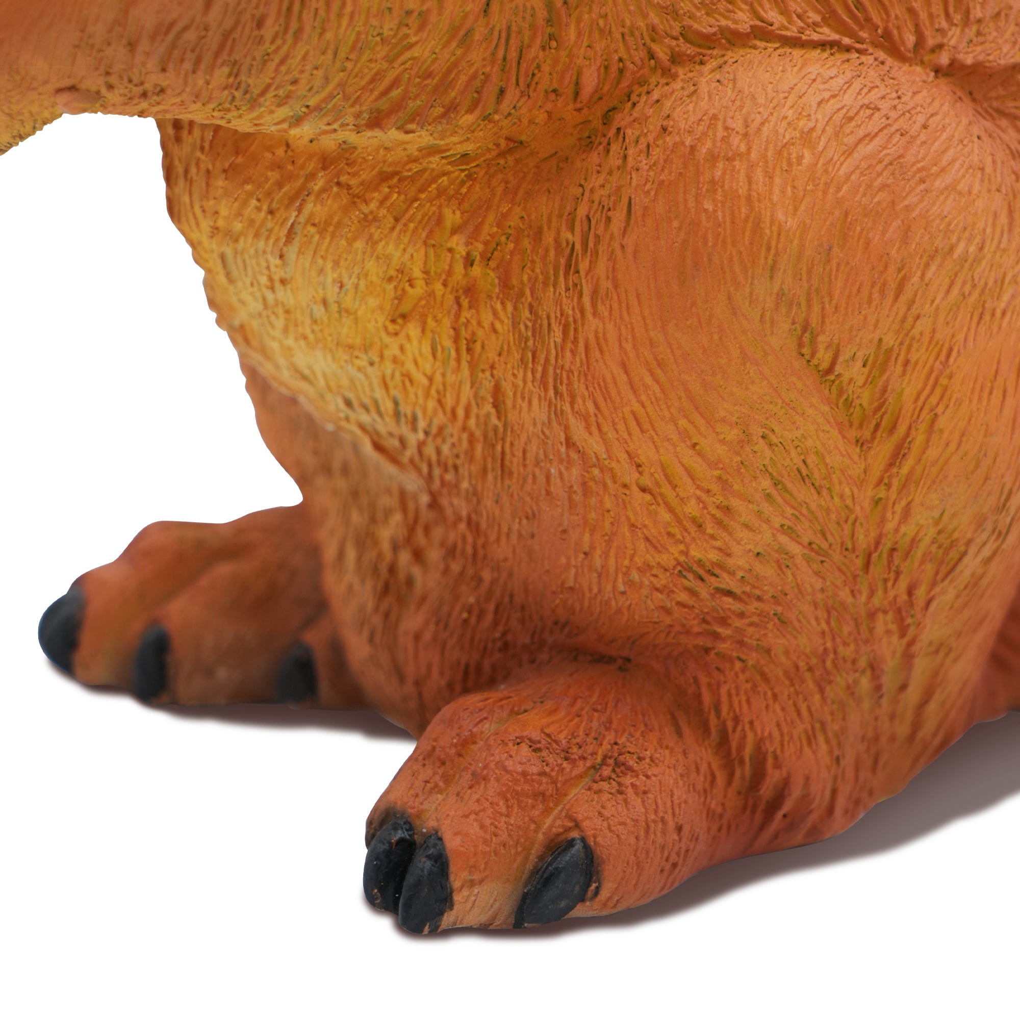 Close-up of the bronze squirrel’s leg showing sculpted texture and lifelike form