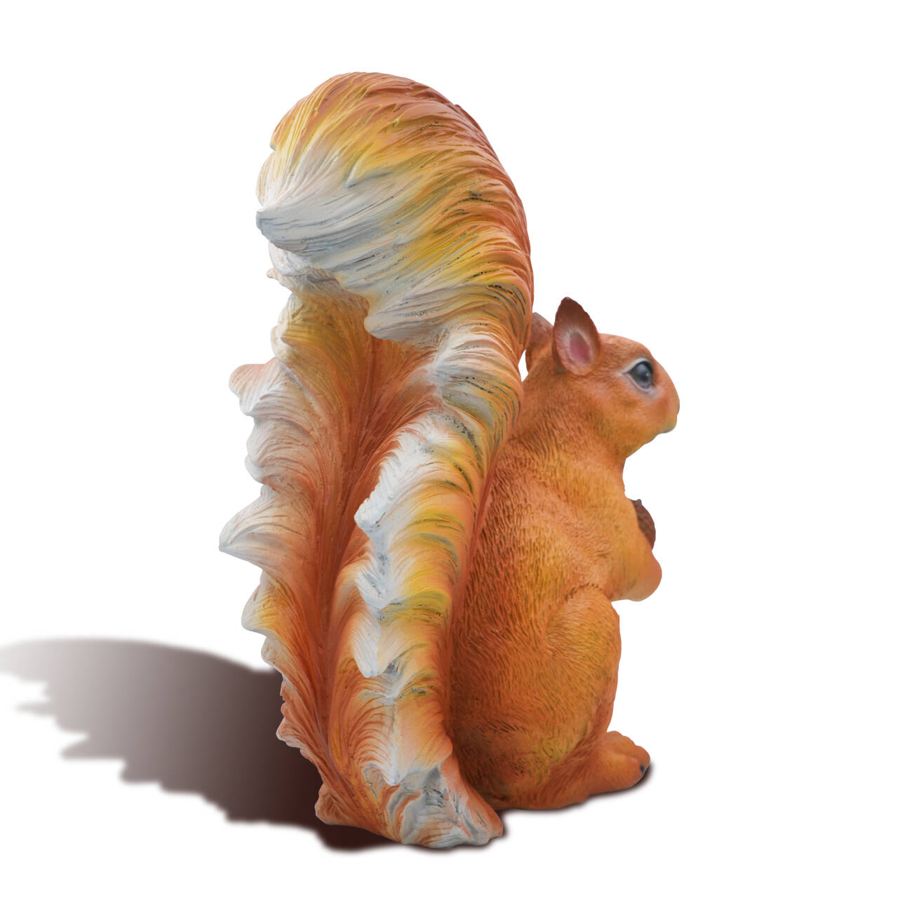 Rear angle of handcrafted bronze squirrel sculpture on white background, showing bushy tail
