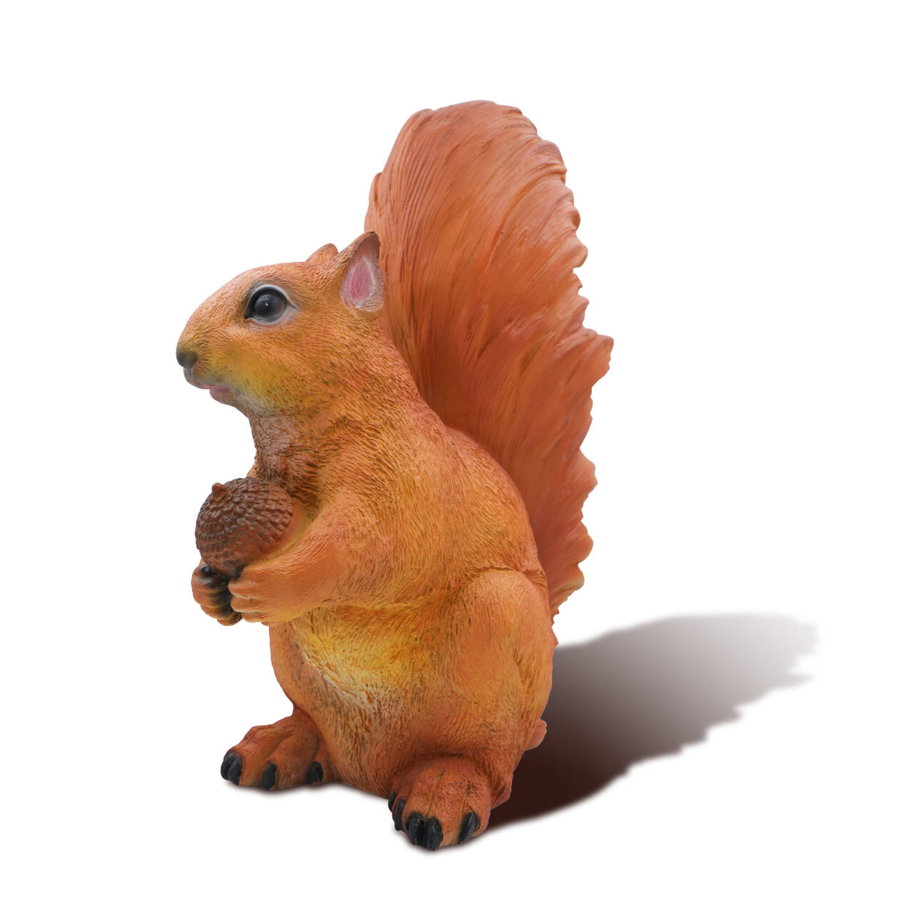 White background image of bronze squirrel statue holding an acorn, side view