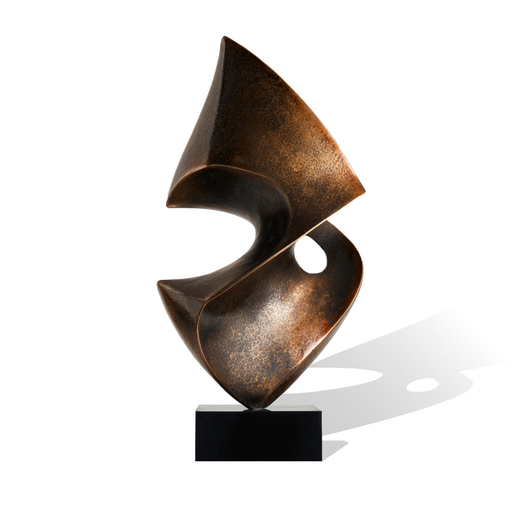 Abstract bronze sculpture on a white background