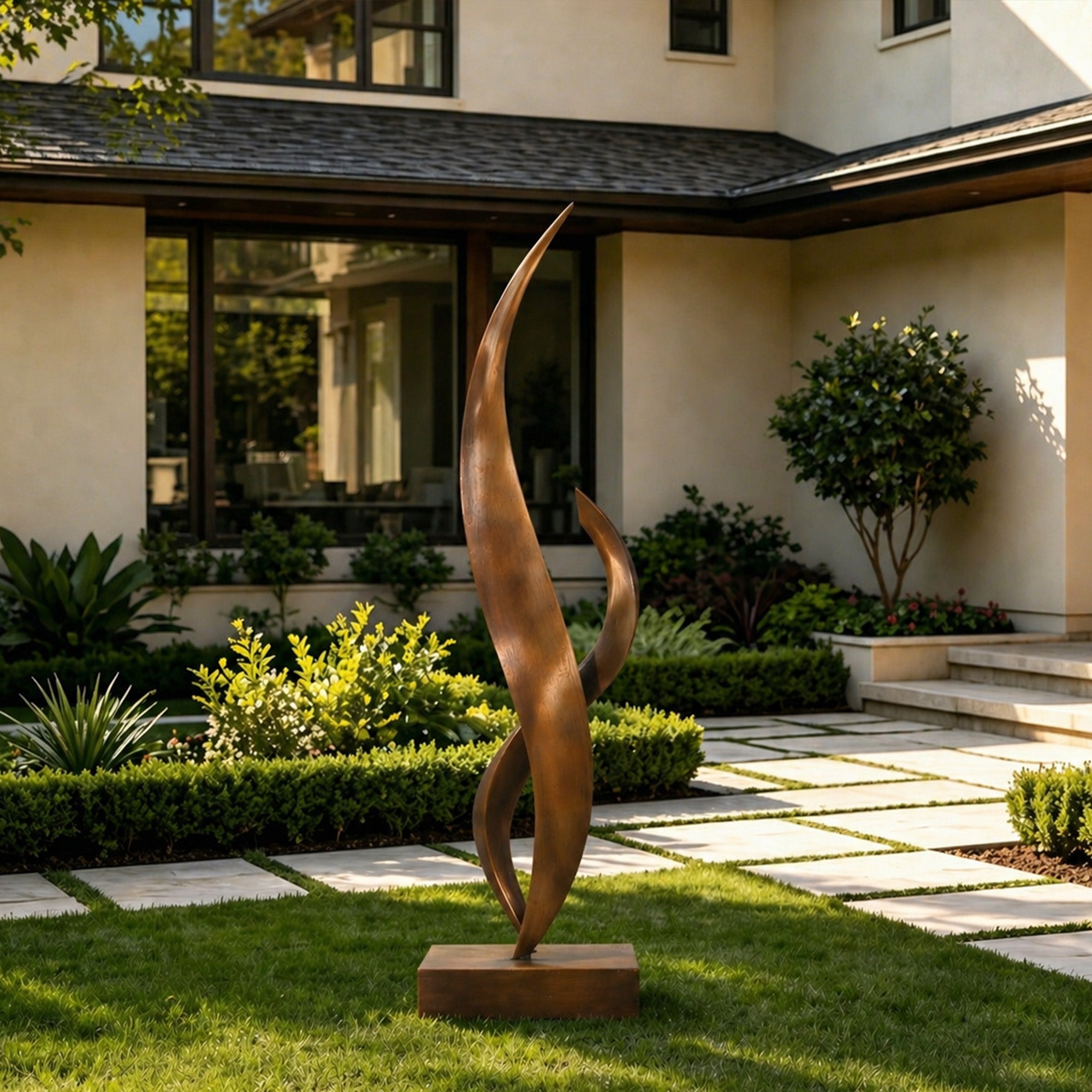 Bronze sculpture in a garden setting with a house in the background