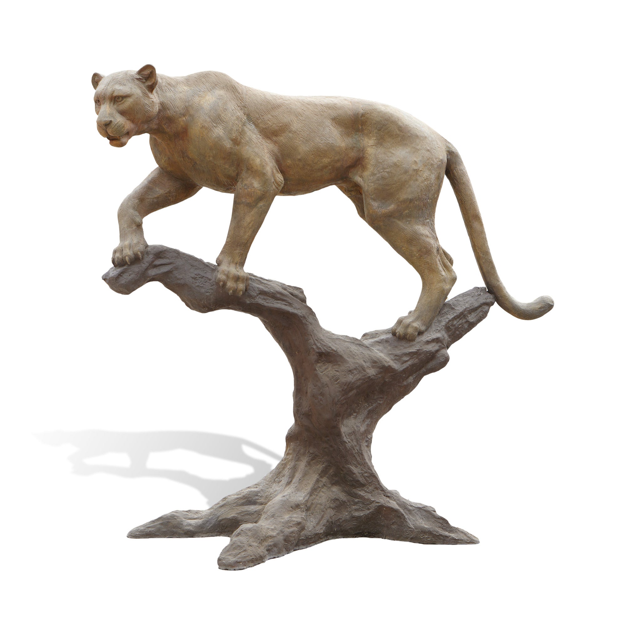 Statue of a lioness on a branch against a white background