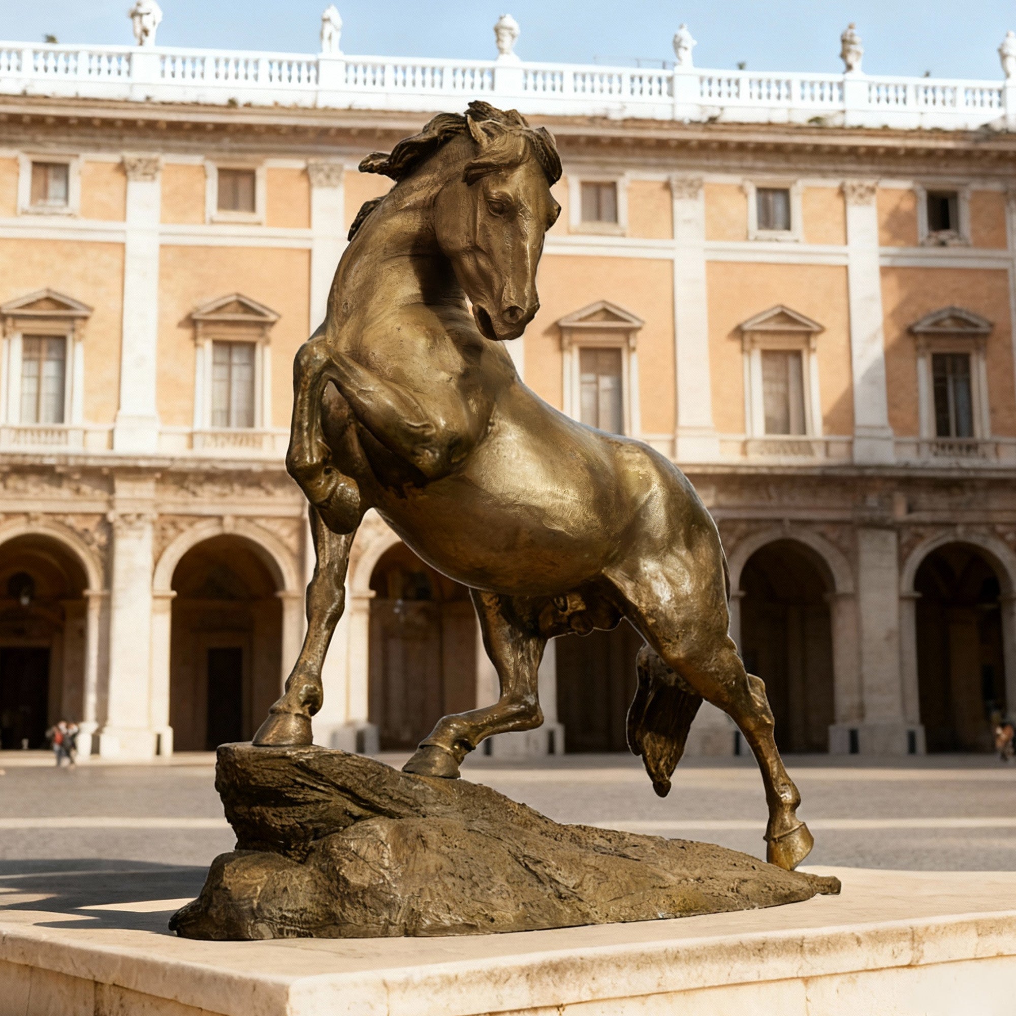 Bronze horse statue in front of a classical building