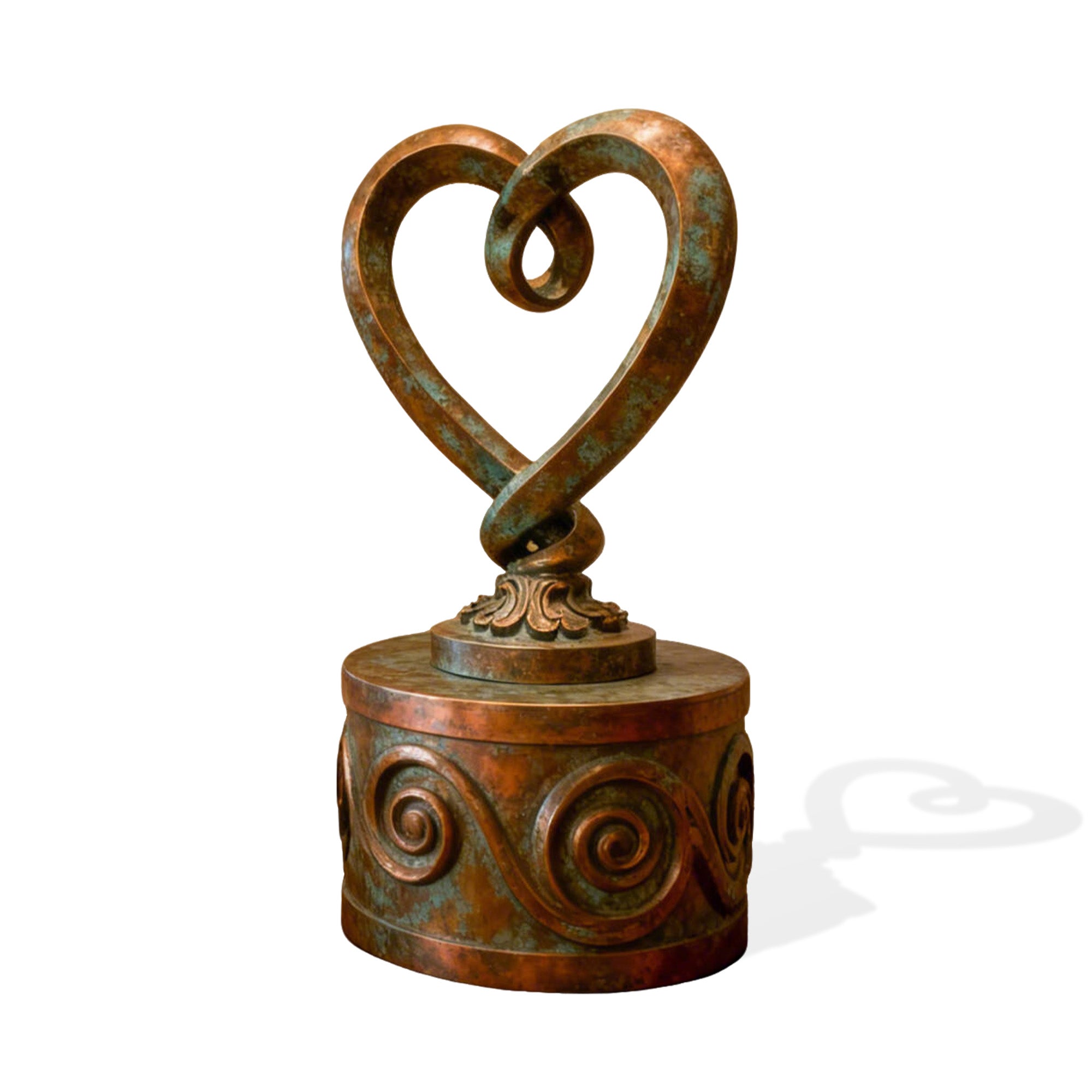 Bronze sculpture of a heart-shaped object on a white background