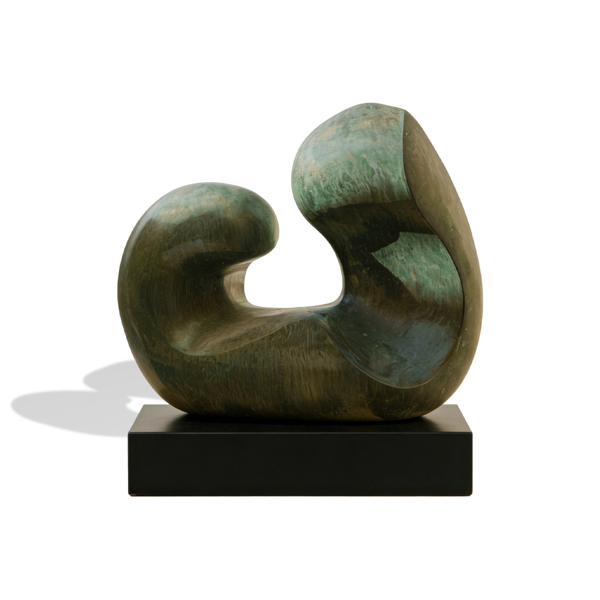 Abstract bronze sculpture on a black base with a white background