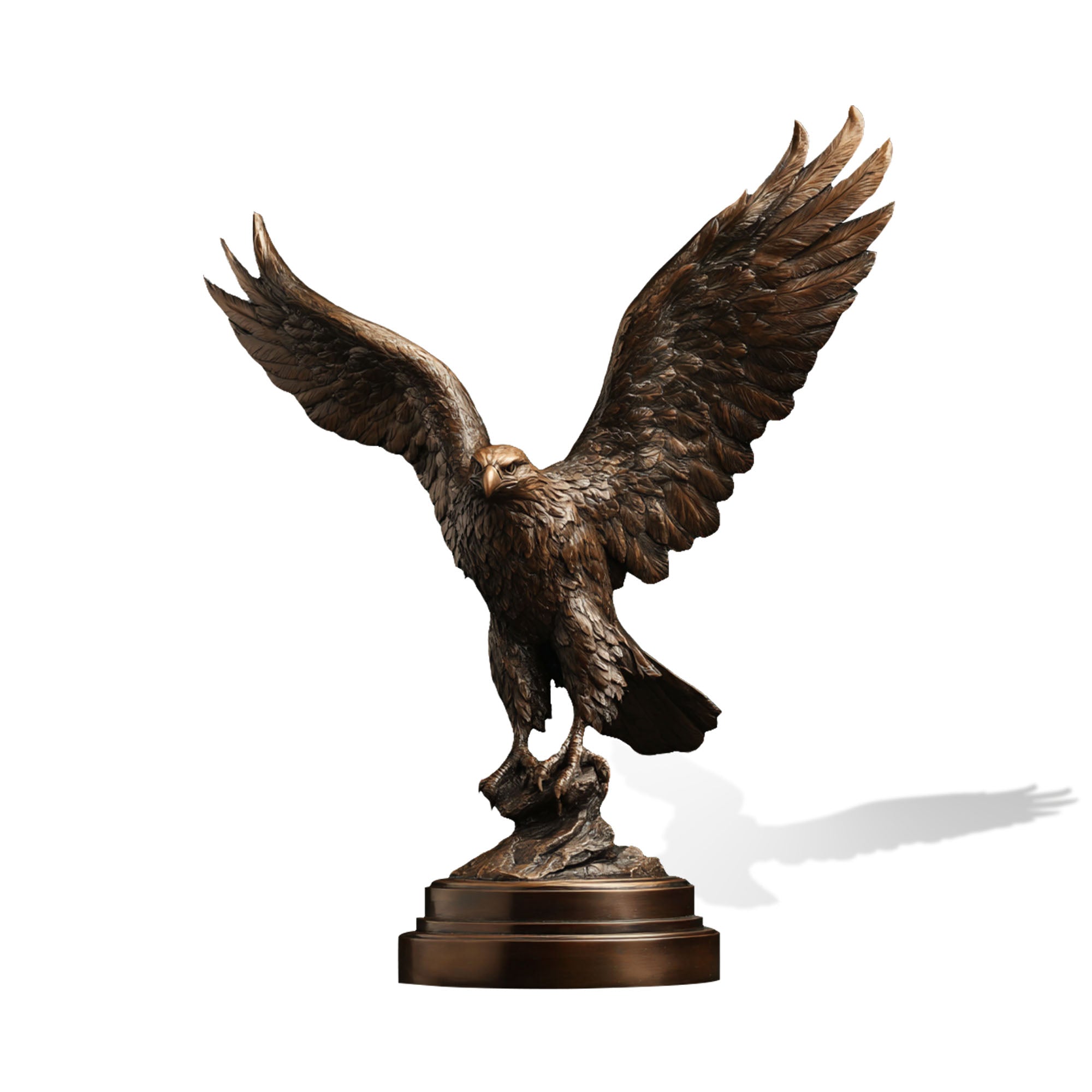 Bronze statue of an eagle with outstretched wings on a white background