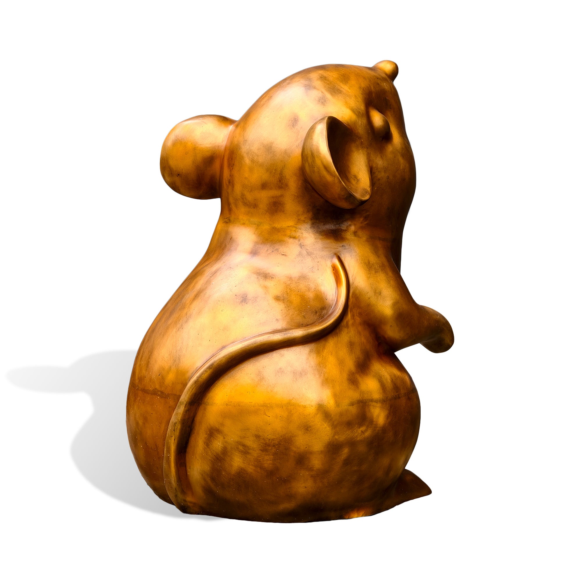 Rear three-quarter view of a golden bronze mouse statue showing a rounded body, sculpted ears, raised paw, and long curved tail