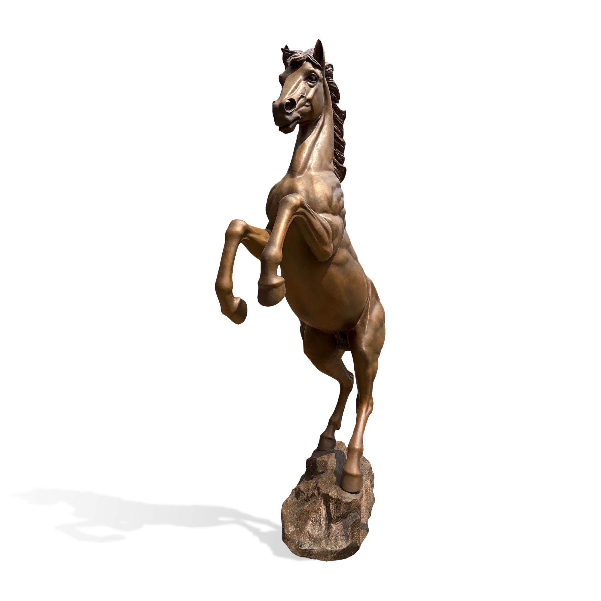 Front three-quarter view of a bronze rearing horse statue standing on a rocky base with lifted front hooves, upright body, expressive face, and sculpted mane.