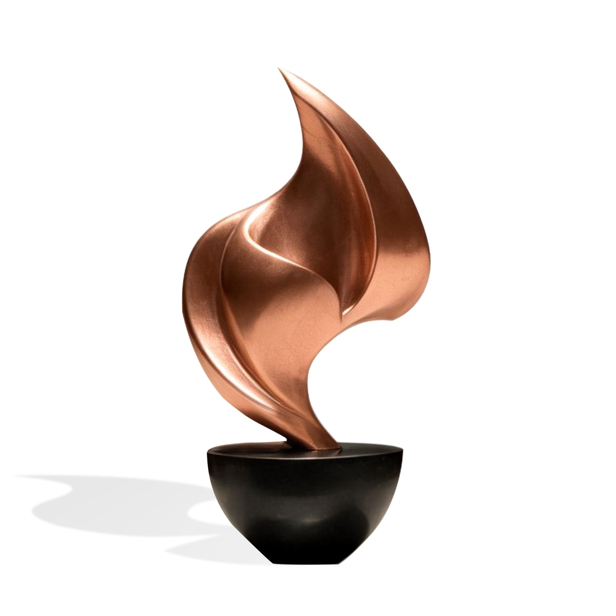 Front view of a bronze abstract flame sculpture, featuring a copper bronze finish, flowing curved form, pointed leaf-like silhouette, and black bowl base.