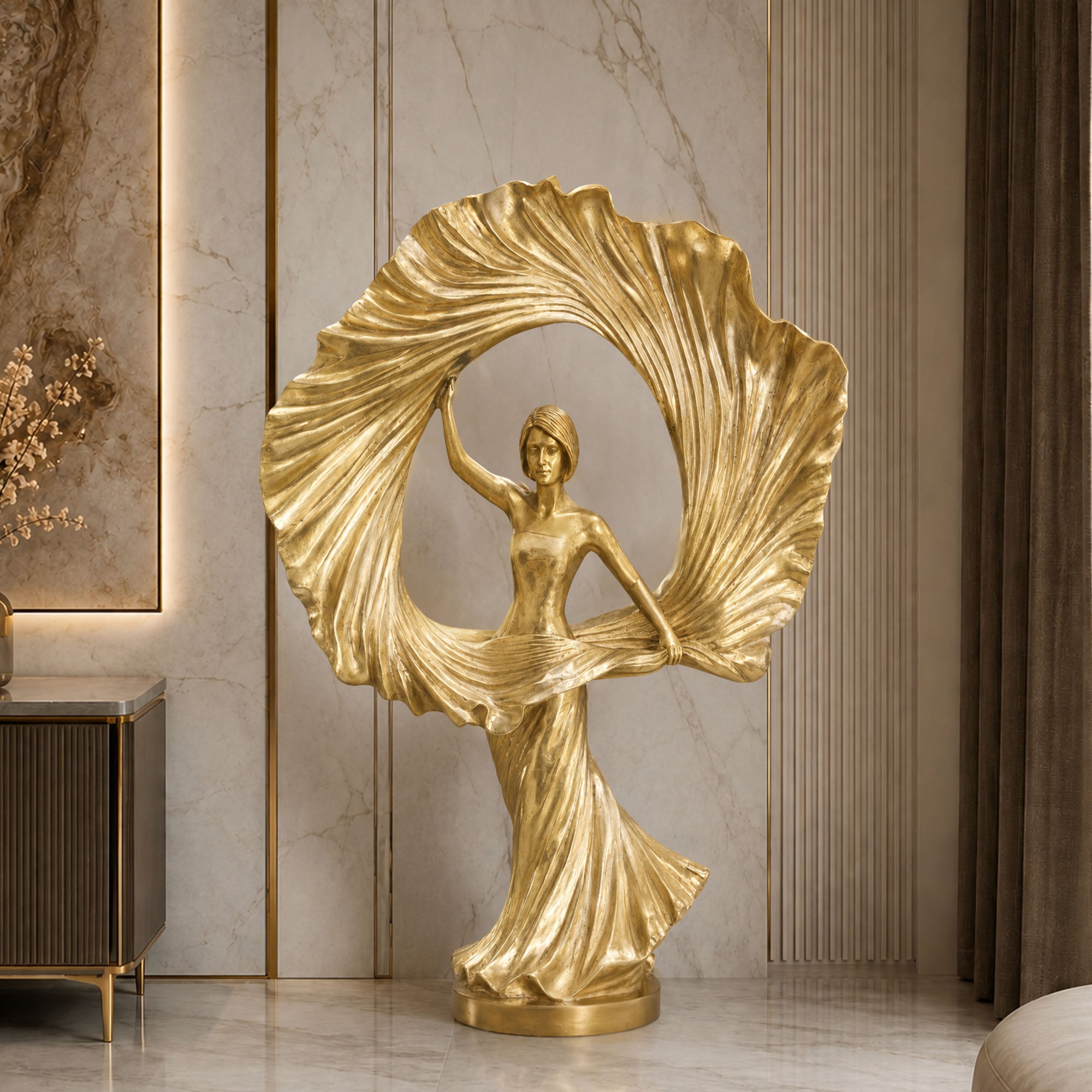 Radiant Muse bronze female sculpture featuring an elegant female figure, dramatic circular form, and antique gold bronze finish, presented as a luxury figurative art piece in a refined interior setting.