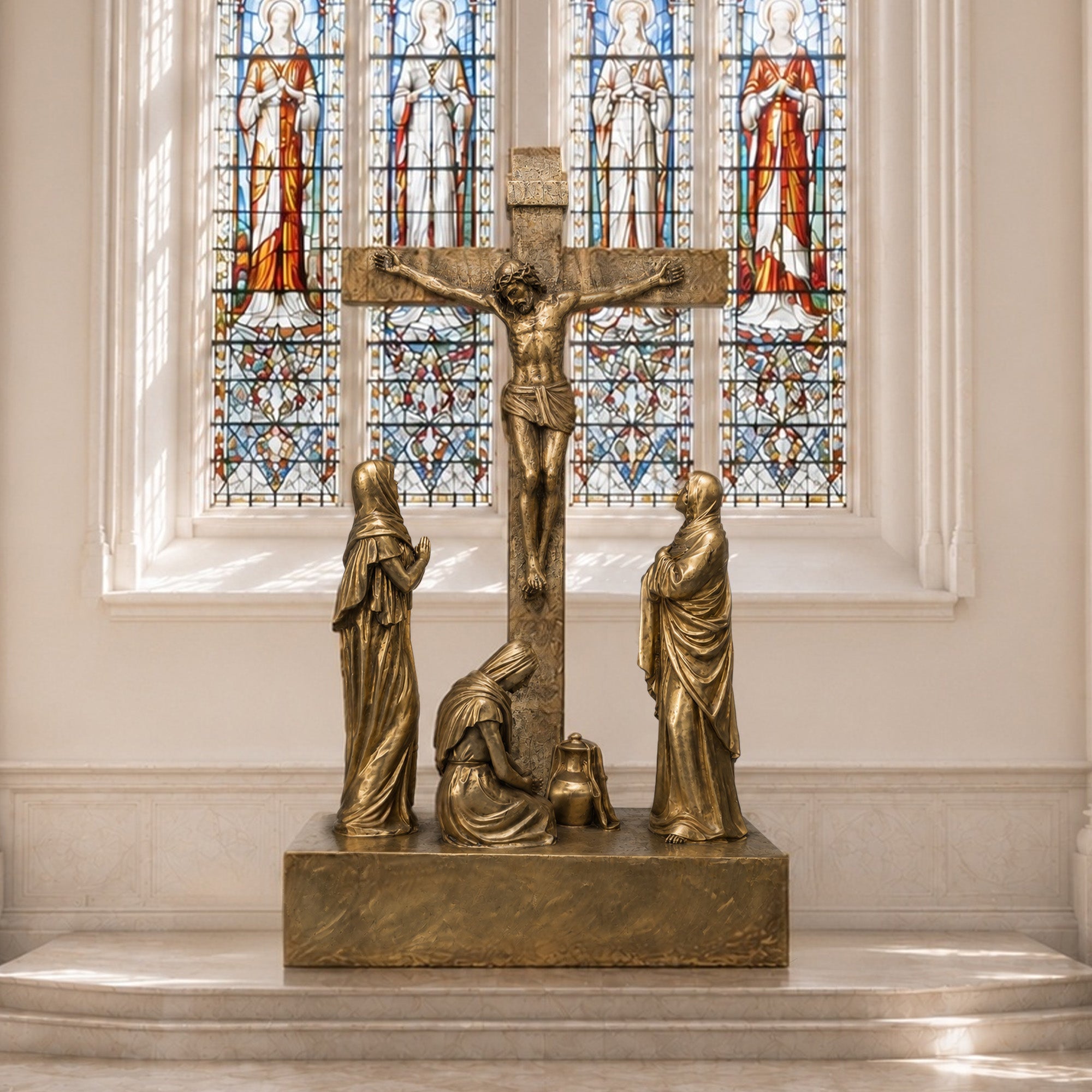Bronze crucifix sculpture depicting Christ on the cross with three devotional figures in a sacred church interior setting.