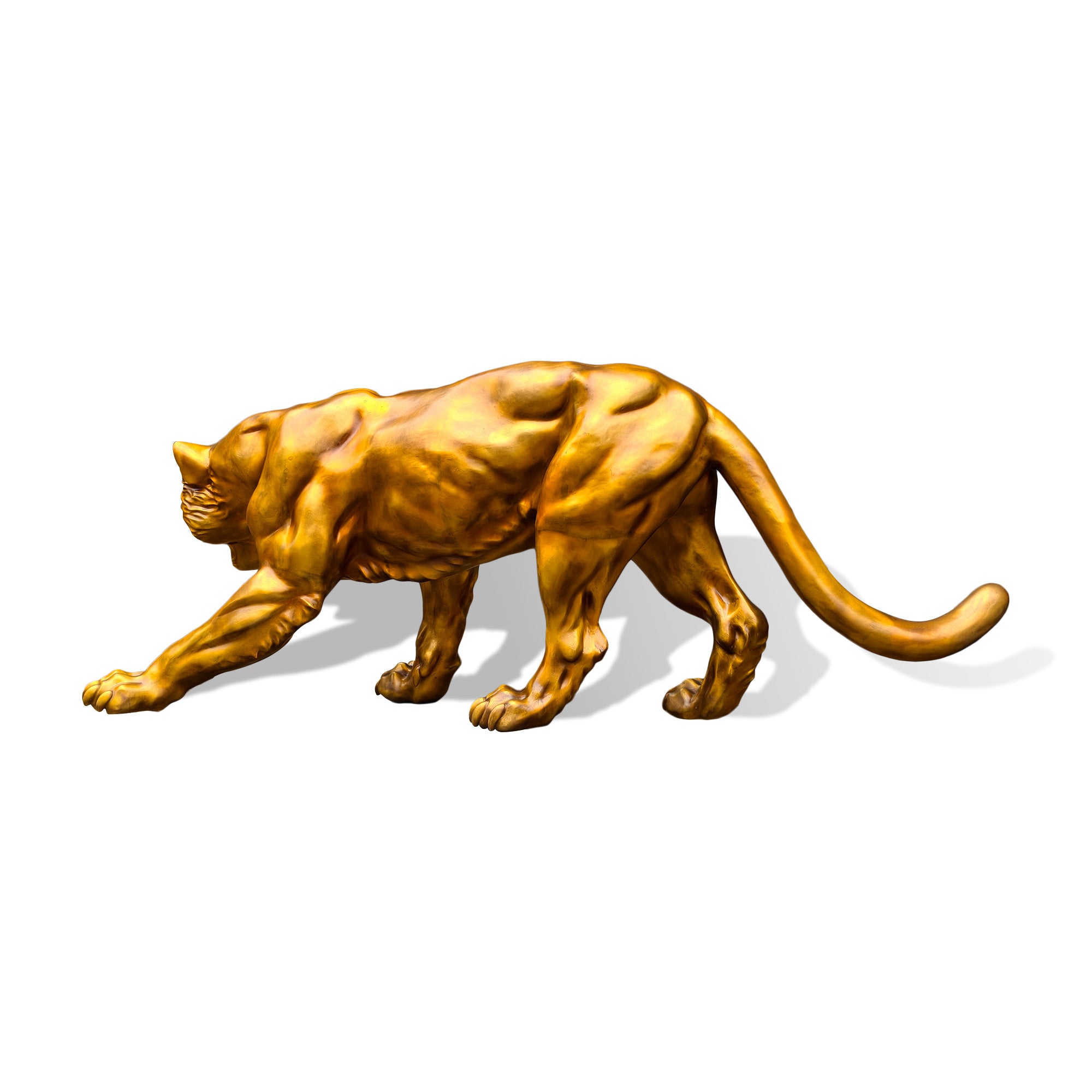 Side profile view of a golden bronze zodiac tiger sculpture in a stalking pose with stretched front leg, muscular body, curved tail, and powerful feline form on a white background.