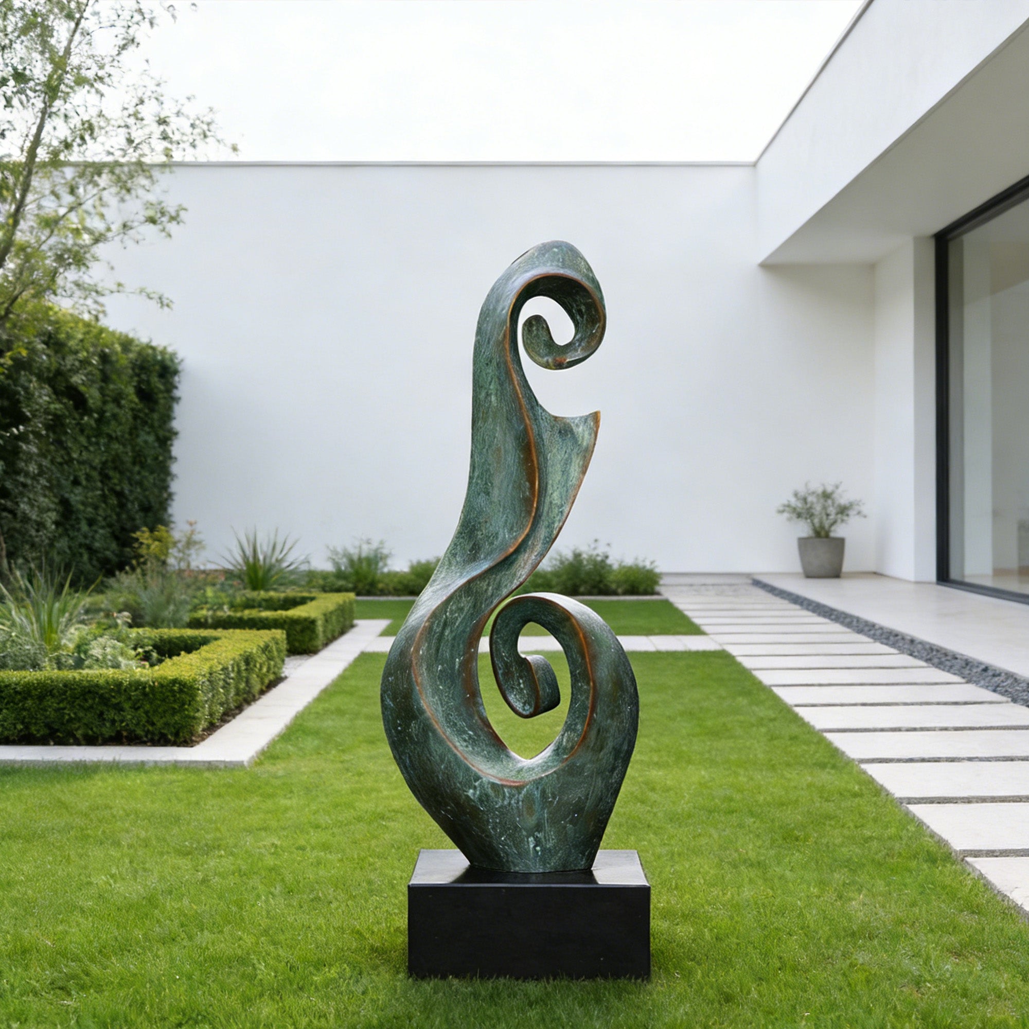 Verdigris bronze scroll sculpture displayed on a black pedestal in a minimalist courtyard lawn with tall flowing curves, spiral openings, and aged green patina finish.