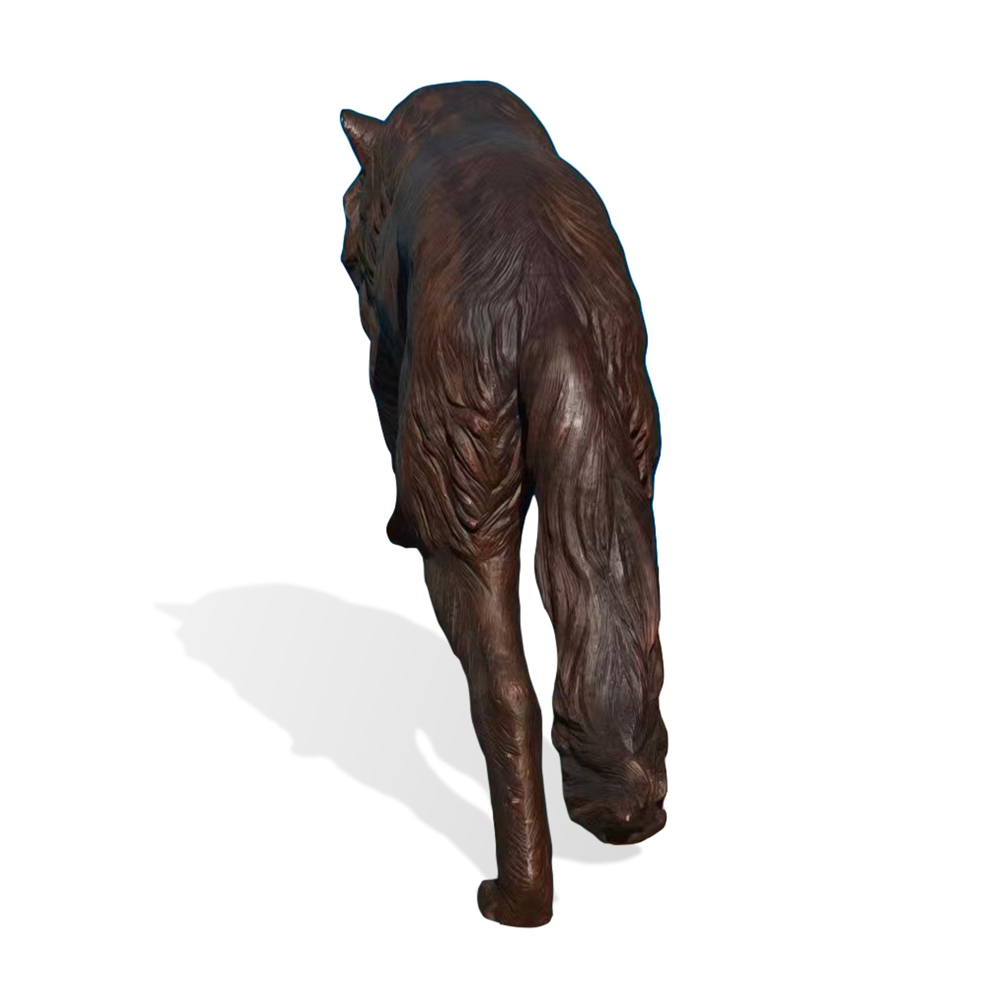 Back view of a realistic walking bronze wolf sculpture showing detailed fur texture, muscular body form, long tail design, and handcrafted wildlife artwork.