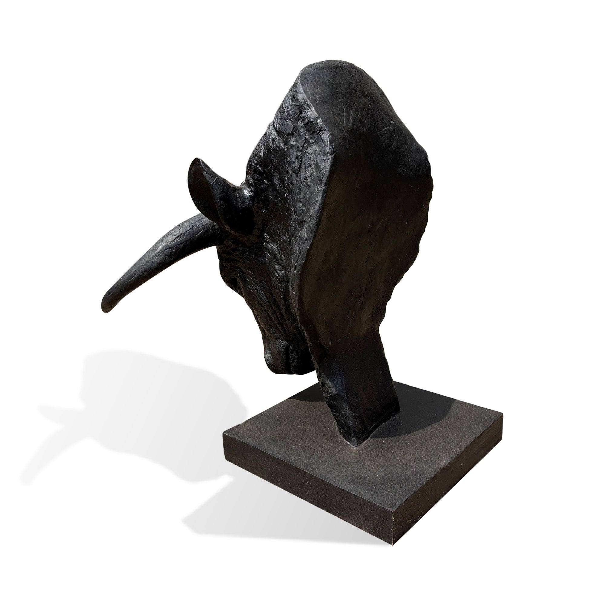 Side view of a black bronze bull head sculpture with sculpted horns, textured surface and strong contemporary animal artwork expression.