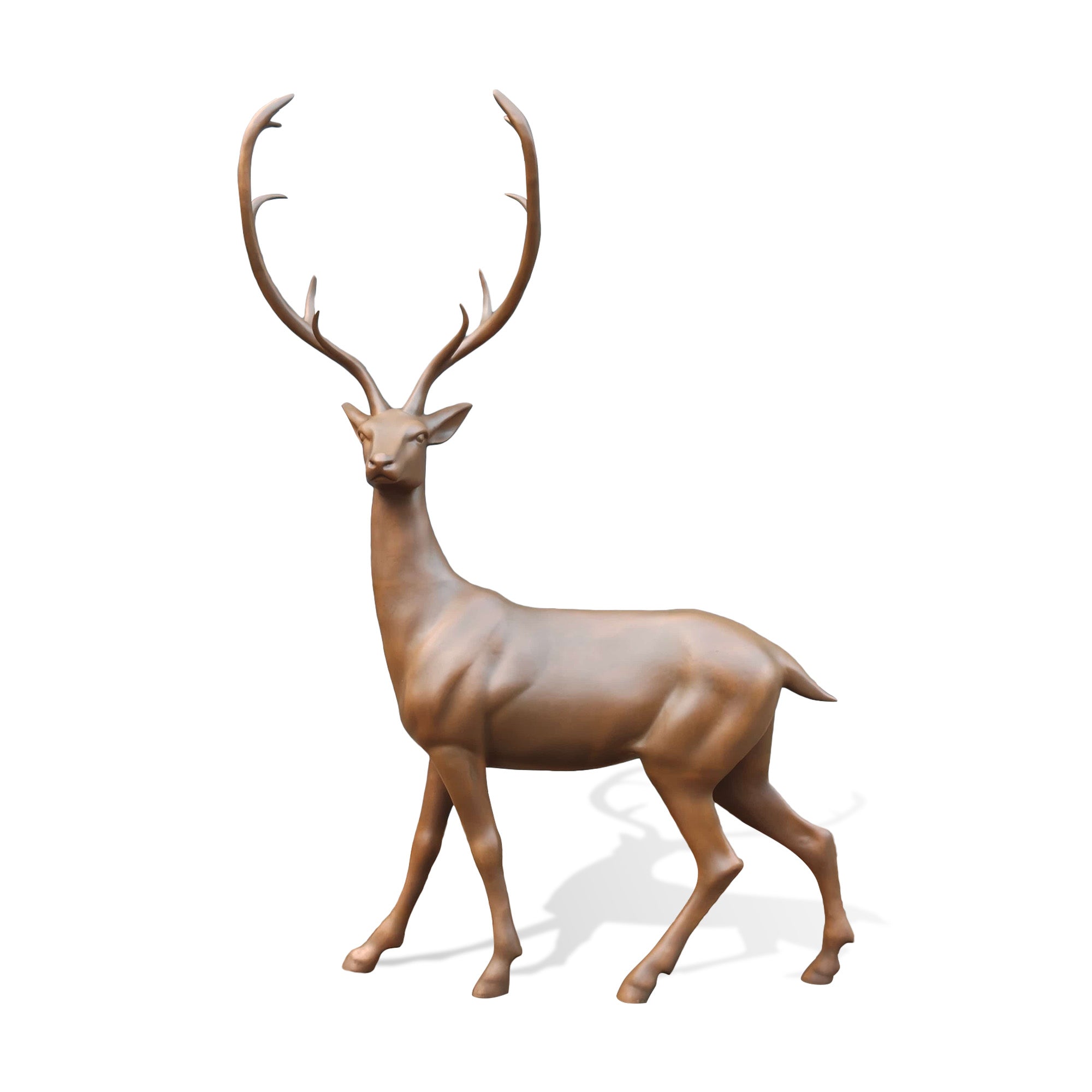 Bronze deer statue shown on a white background from the front side, with an elegant walking posture, slender body, long legs, and prominent upward-curving antlers.