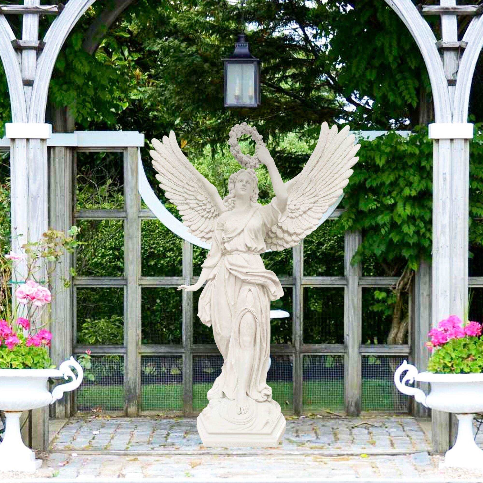 white color elegent angel fiberglass statue with flower ring aloft on hand