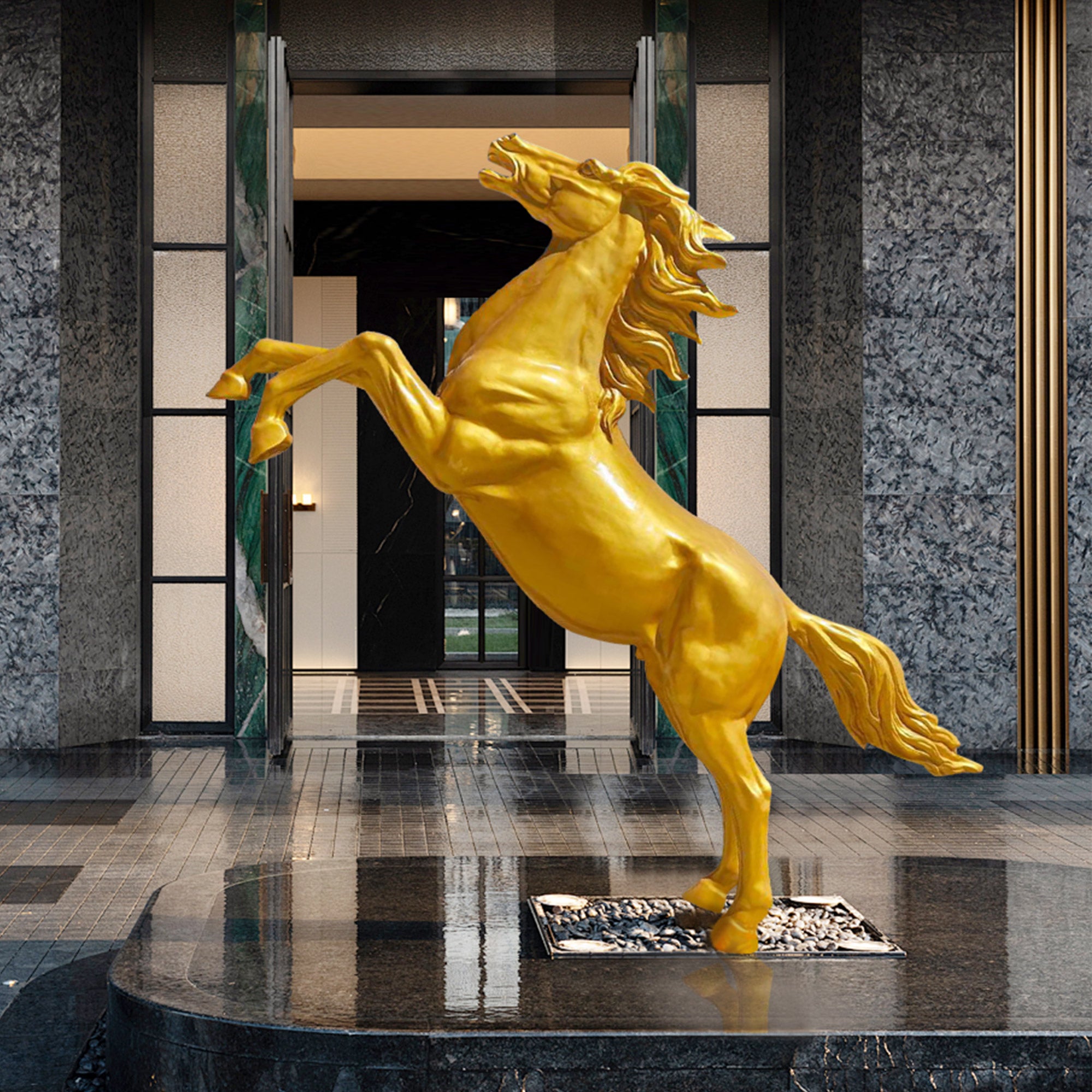 Golden fiberglass rearing horse sculpture with a glossy finish, displayed in a modern lobby.