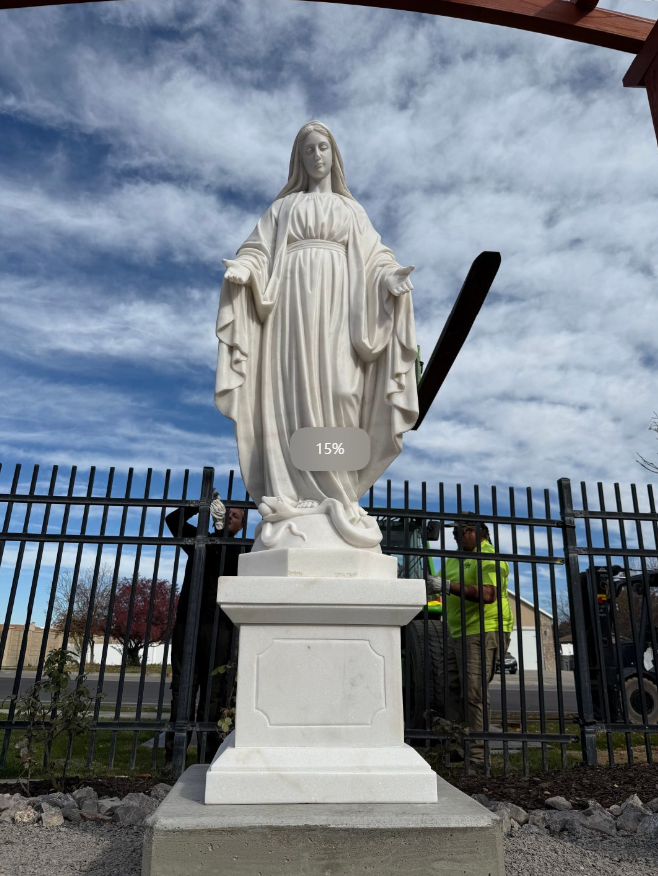Mary statue, elegantly standing on a pedestal in an outdoor setting, with natural light highlighting the detailed craftsmanship and serene expression