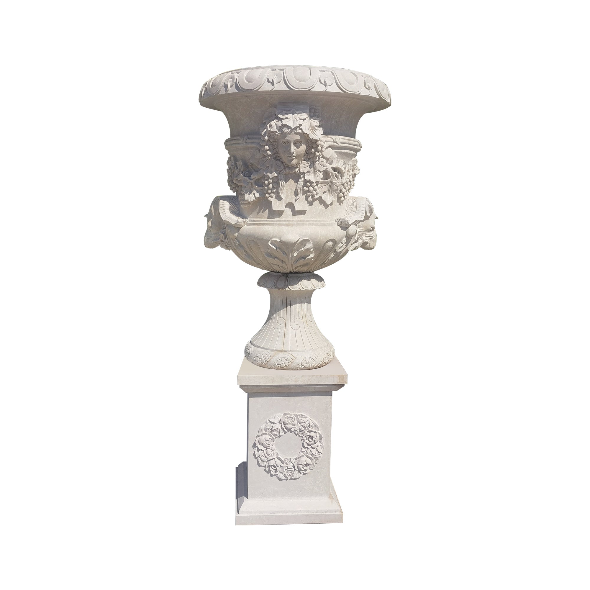 Decorative white marble urn with intricate designs on a white background
