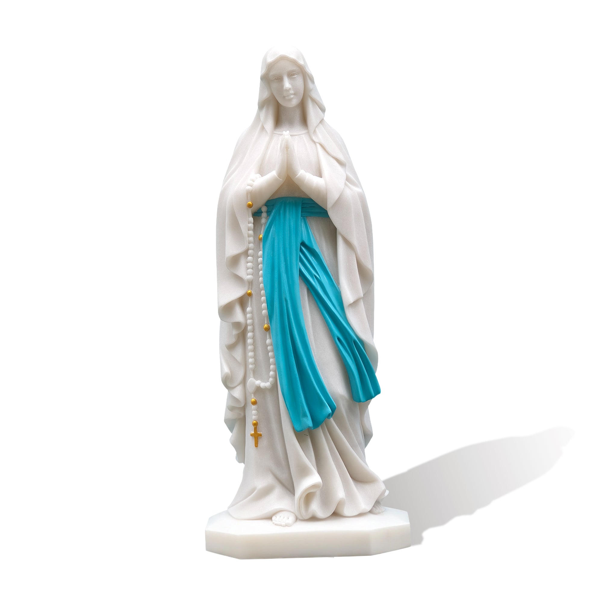 Front view of Our Lady of Lourdes white marble statue on plain background
