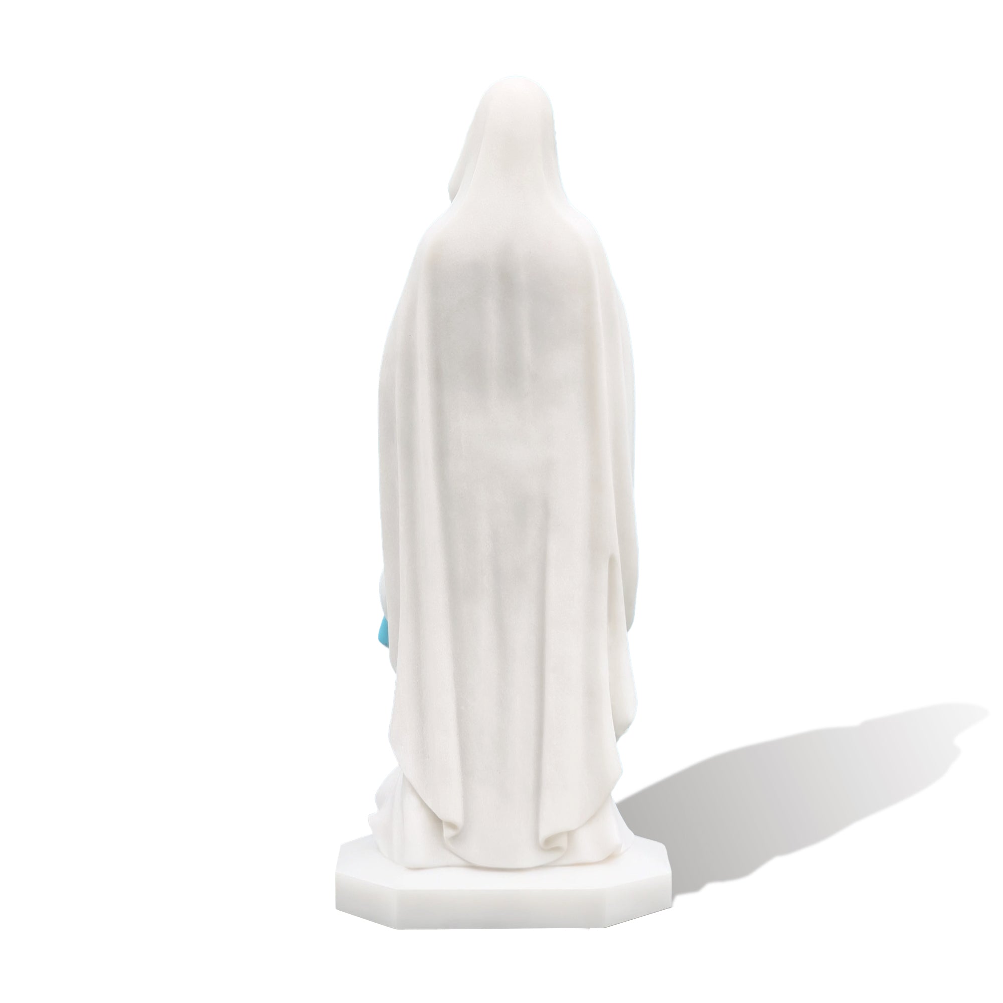 Back view of Our Lady of Lourdes marble garden statue against white backdrop
