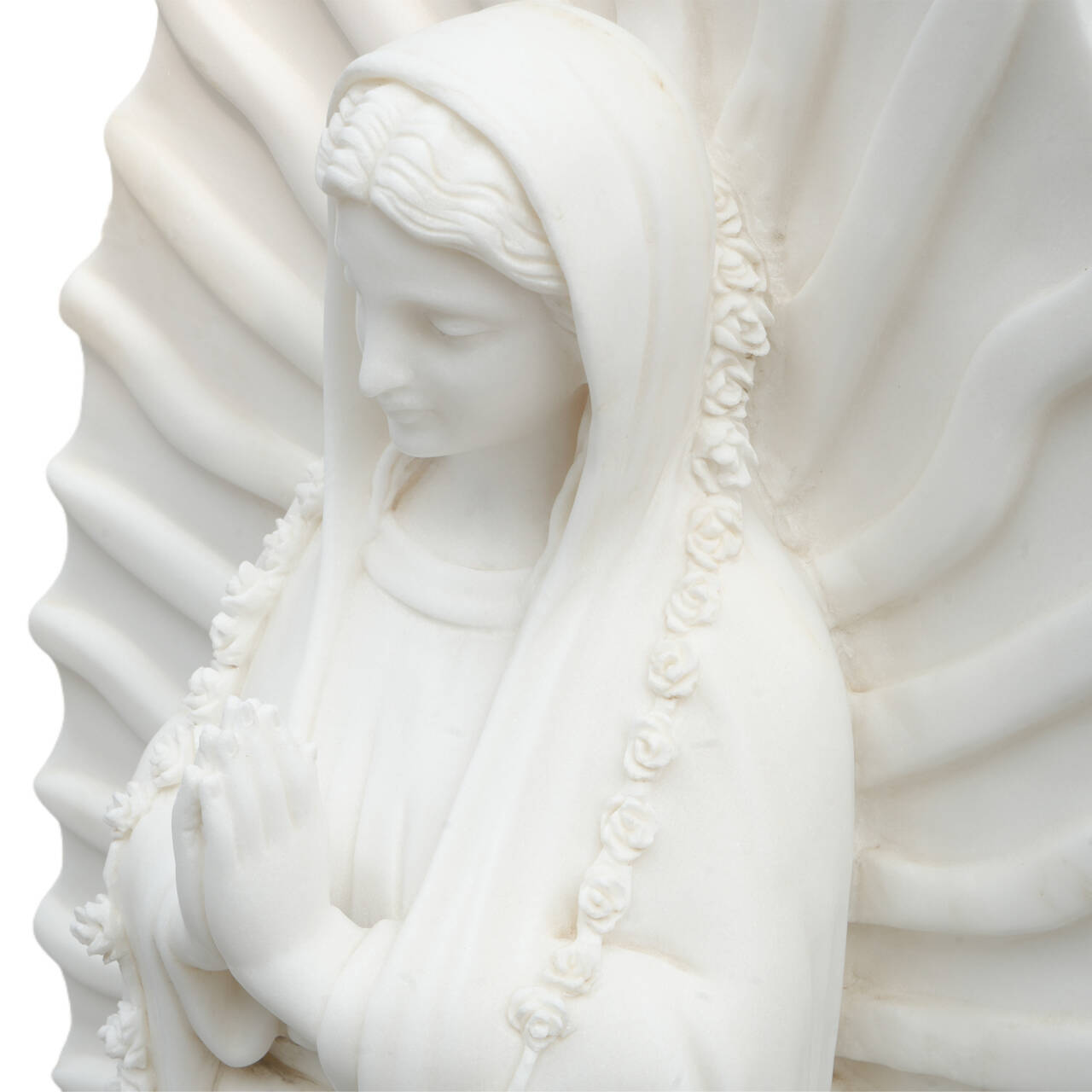 detail carving of our lady of guadalupe white marble statue catholic religious art with praying hands