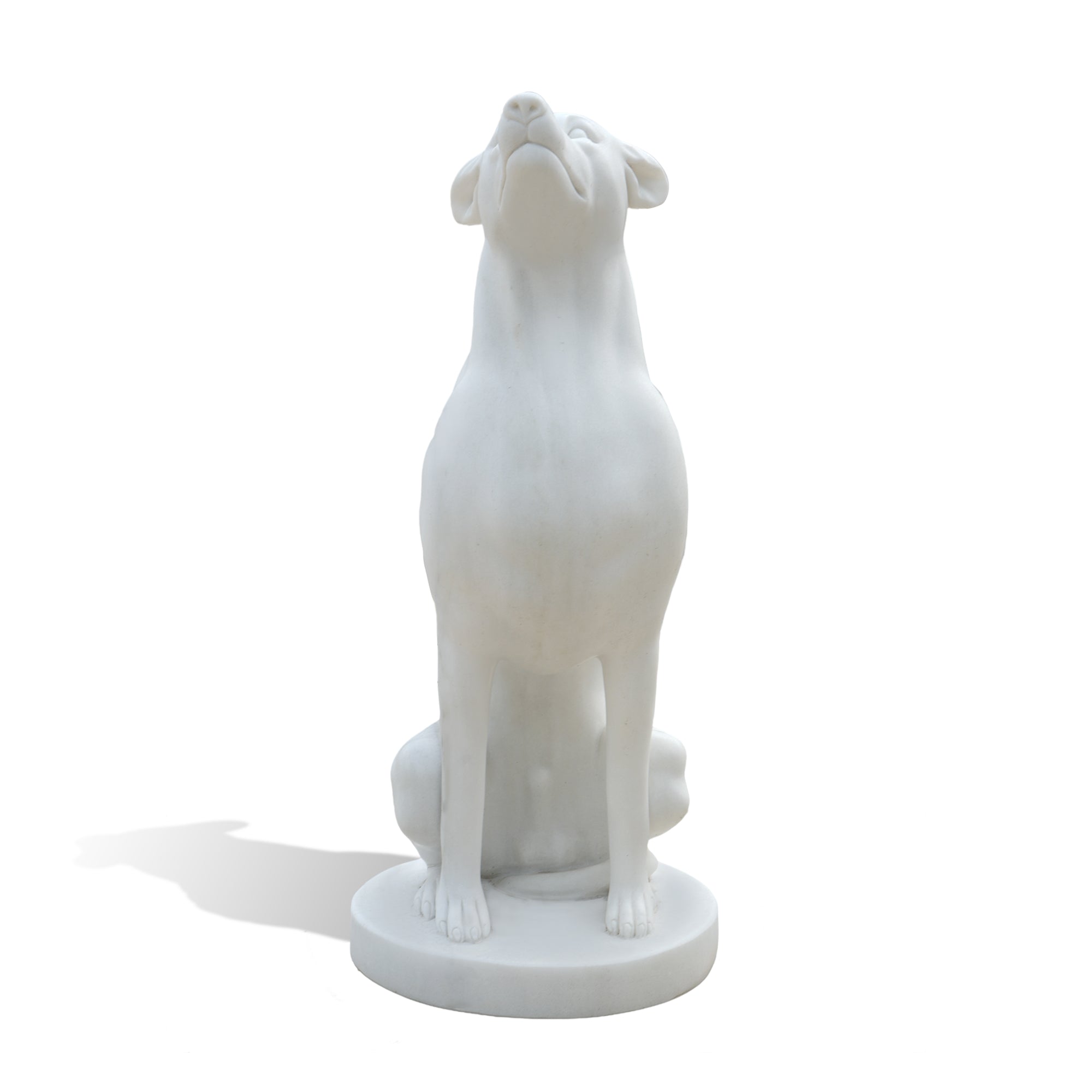 front view of white marble dog statue sitting upright with classical guardian style