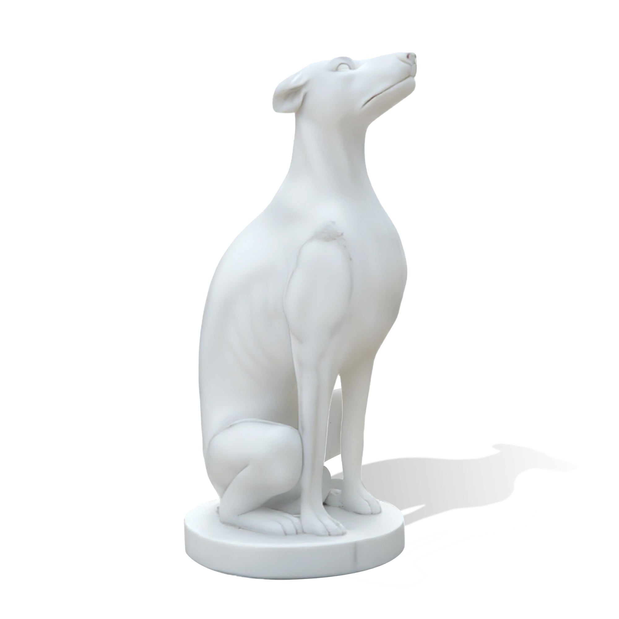 side view of natural white marble dog statue with elegant posture and detailed carving
