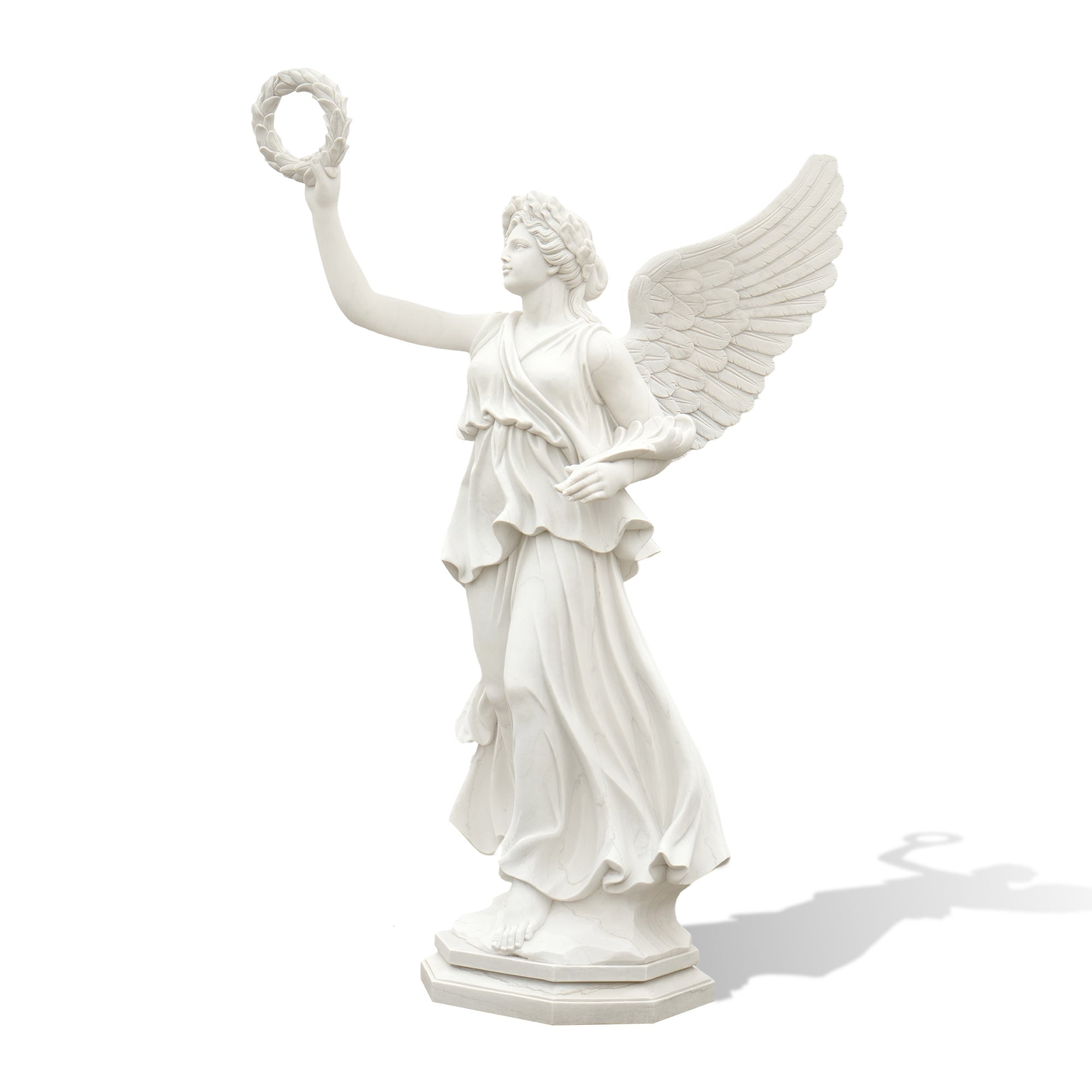 Side angle of white marble statue of goddess Victoria holding laurel wreath, Roman classical sculpture for garden decor