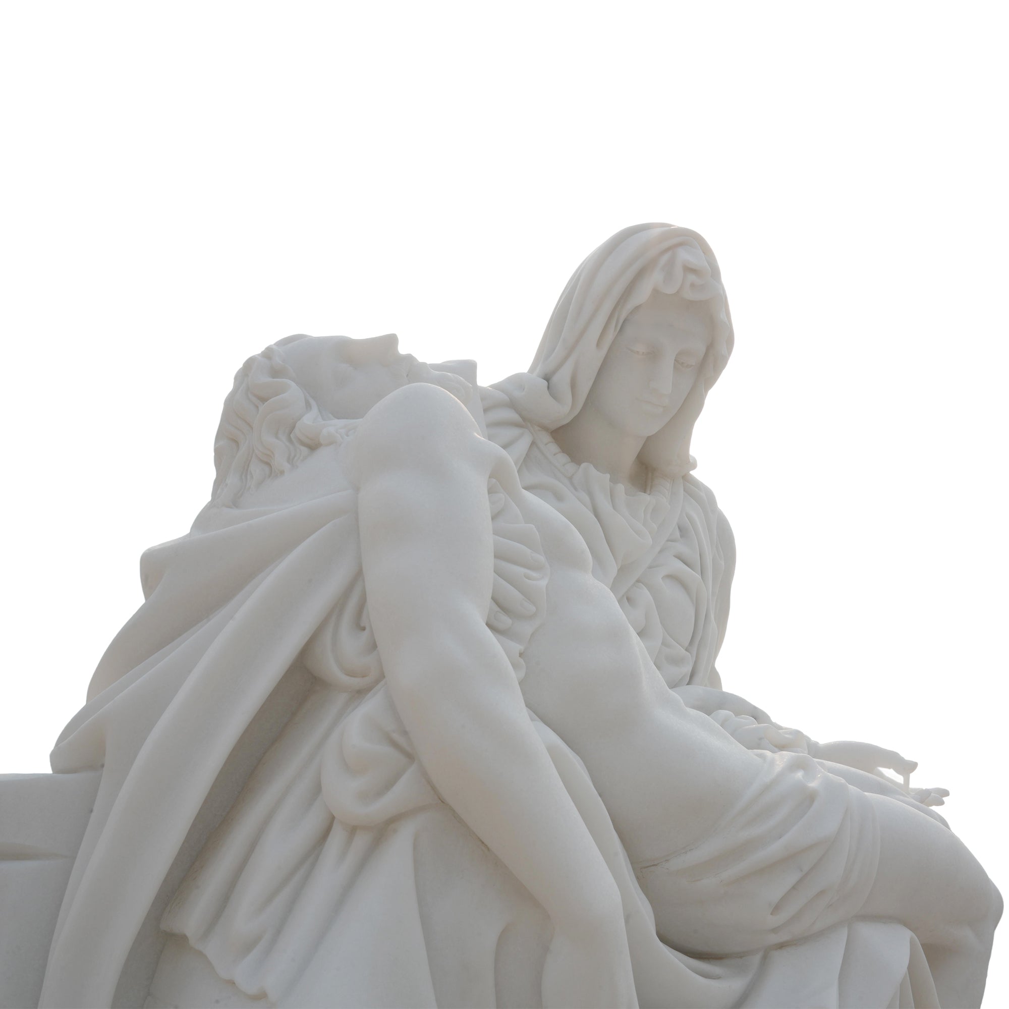 Hand-carved marble Pietà sculpture detail showing Virgin Mary’s serene face and sorrowful expression holding Christ.