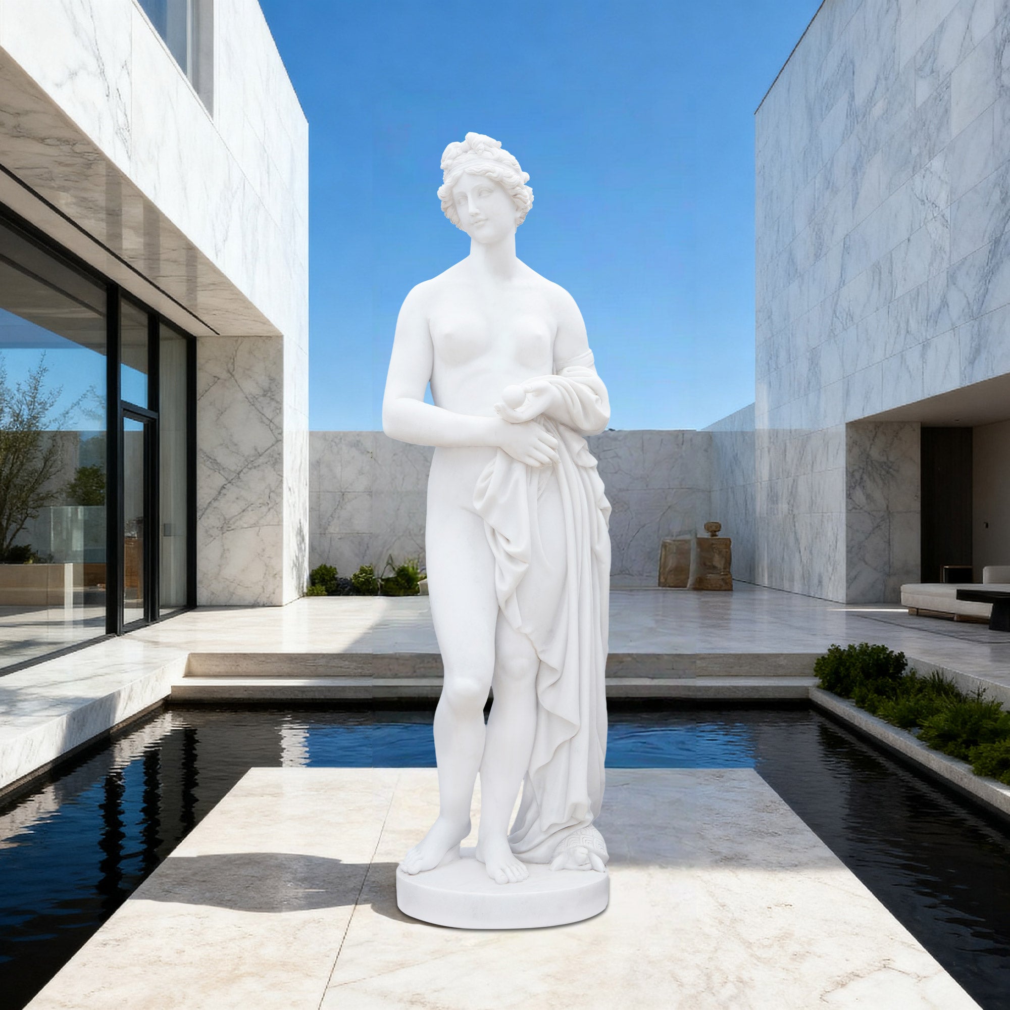 A marble replica of Aphrodite set within a modern courtyard, blending classical goddess form with contemporary architectural surroundings.
