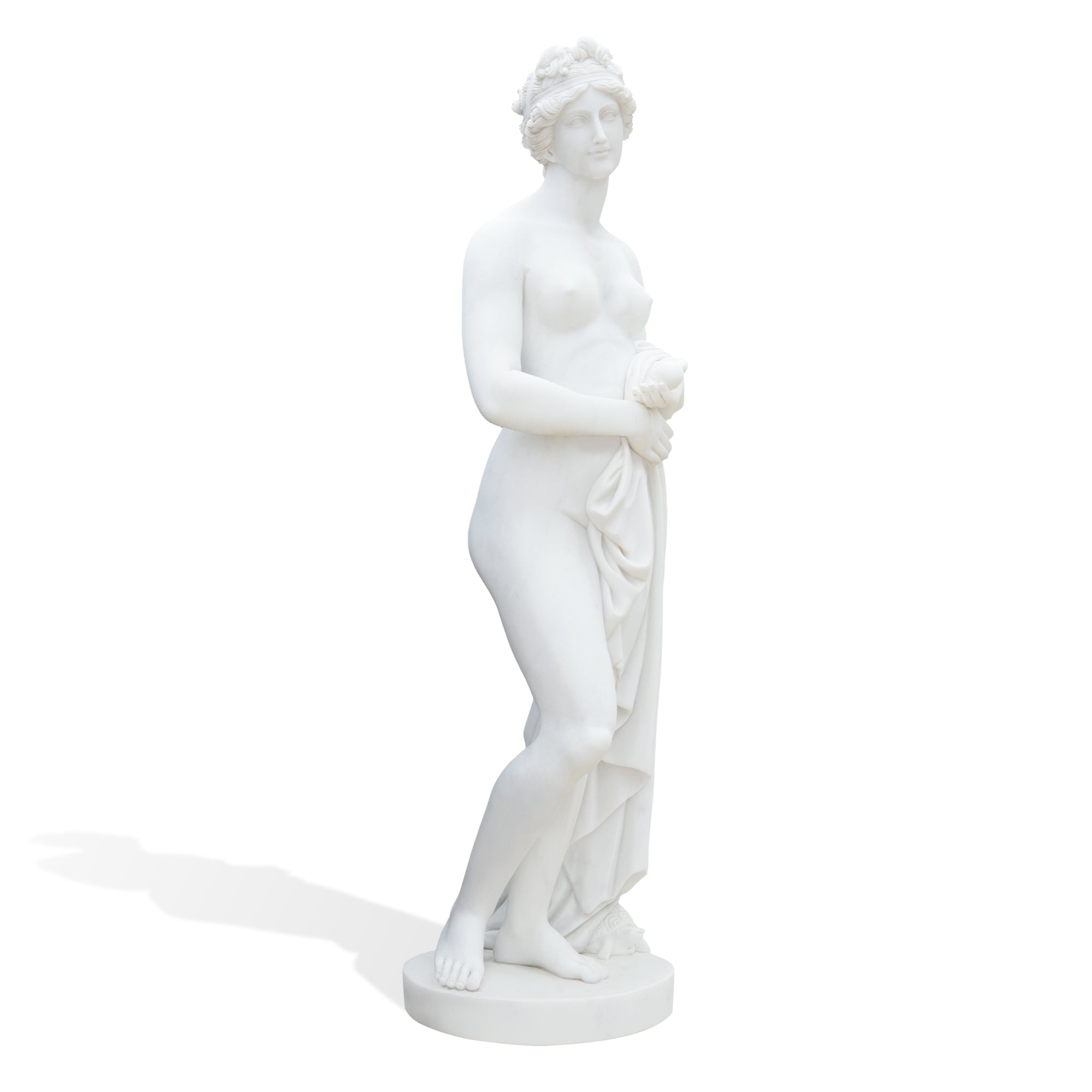 A full-body view of the marble goddess figure inspired by the ancient Aphrodite of Knidos, presenting a contemporary sculptural interpretation with smooth detailing.