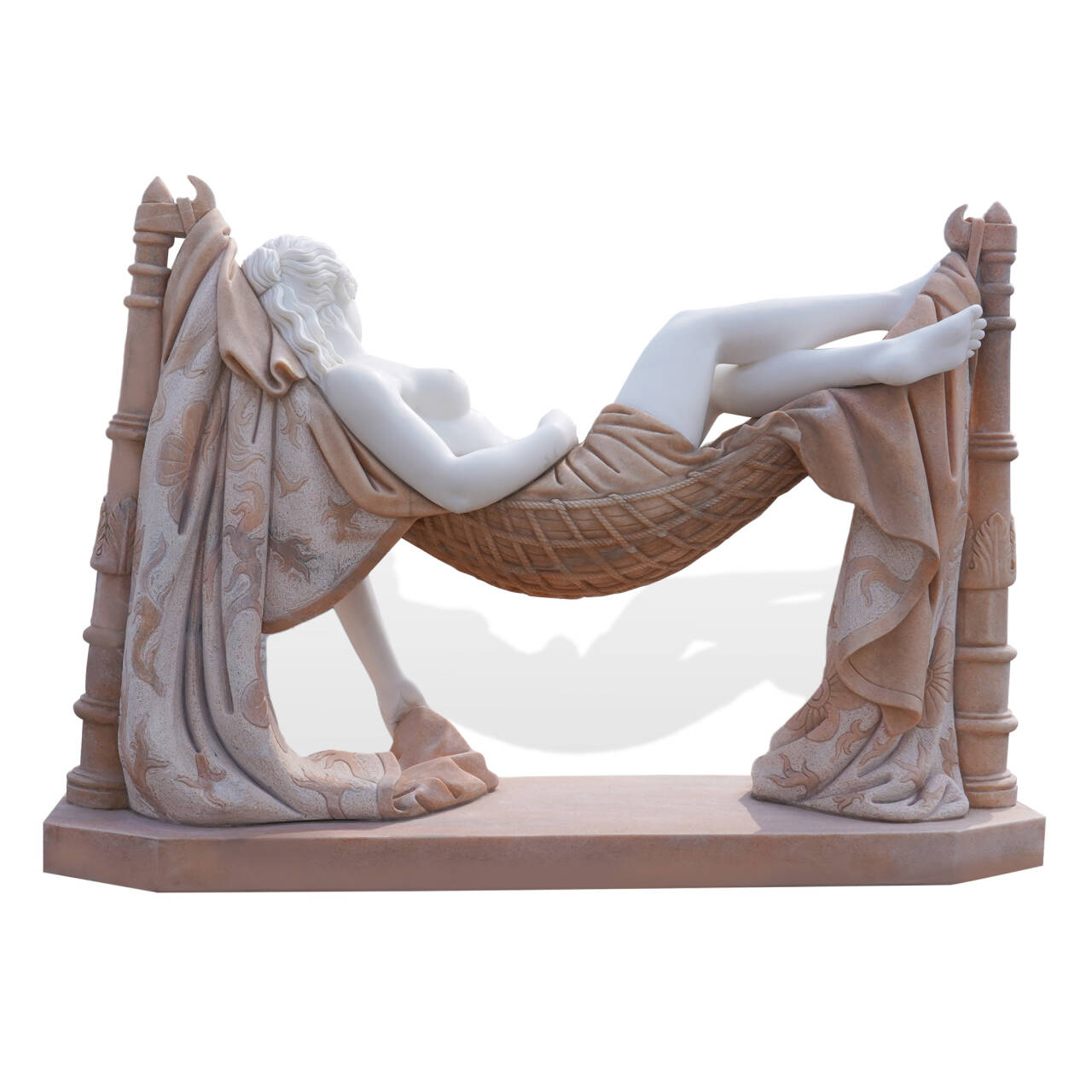White marble reclining woman sculpture in a tranquil garden setting, her relaxed pose and detailed drapery creating an elegant focal point in the outdoor environment.
