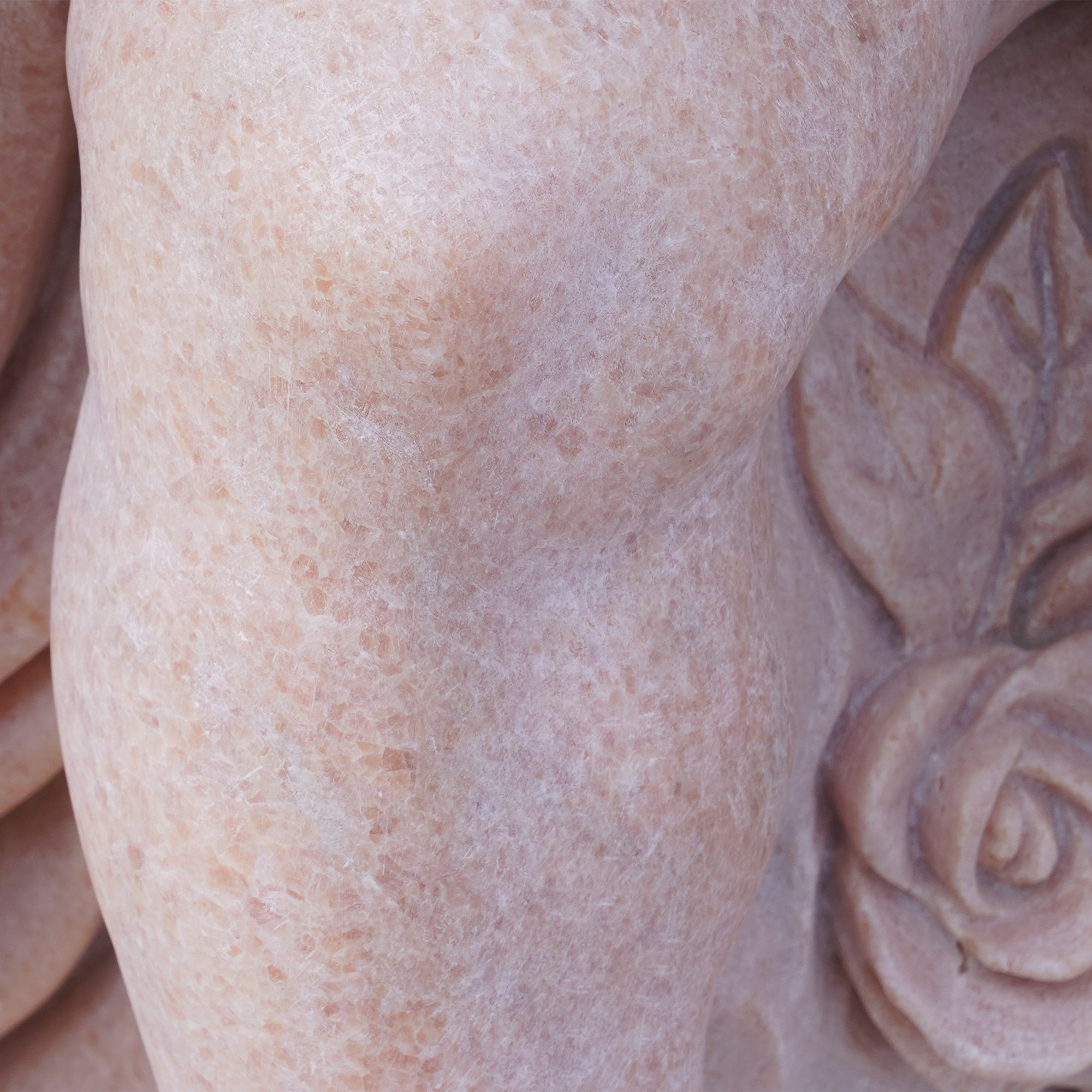 A detailed view of the marble and sesame red granite sculpture featuring two children, embodying romantic friendship. Perfect for elegant garden spaces and high-end interior design
