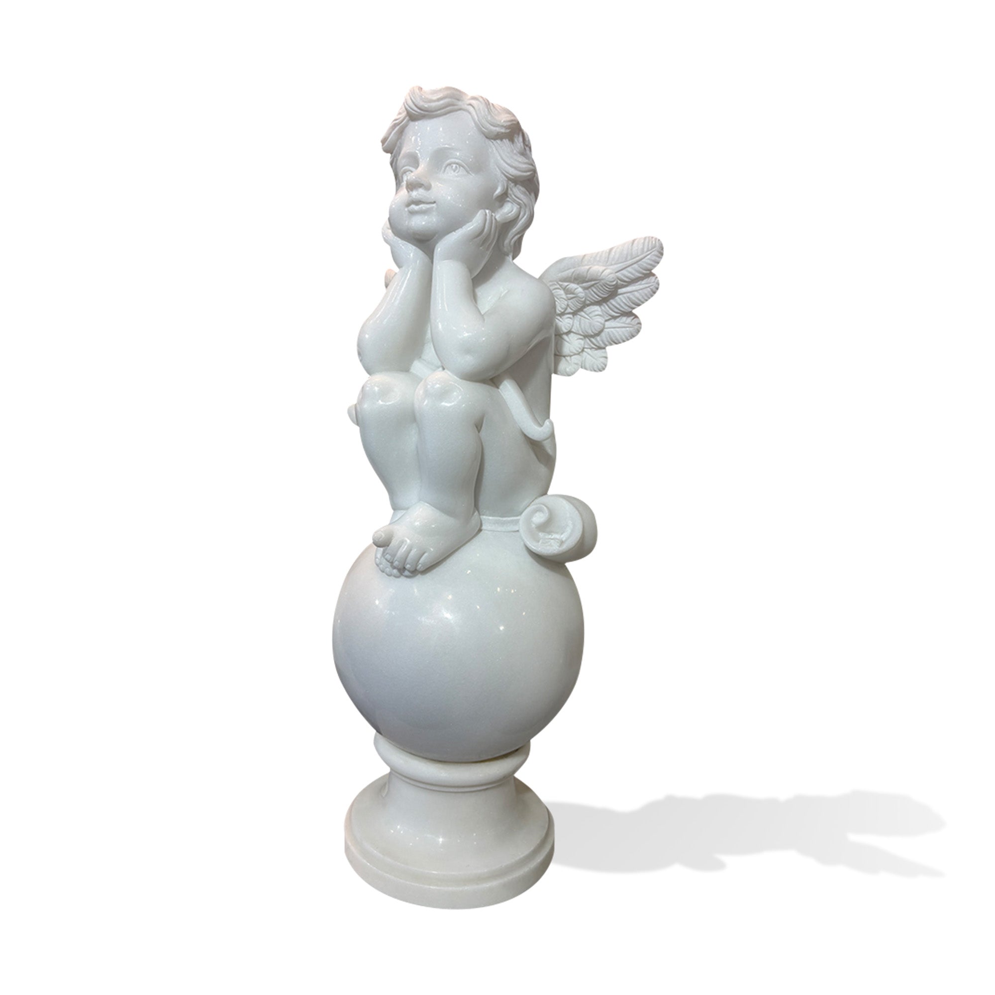 white marble cherub garden statue with wings seated on a sphere, front left view on plain background
