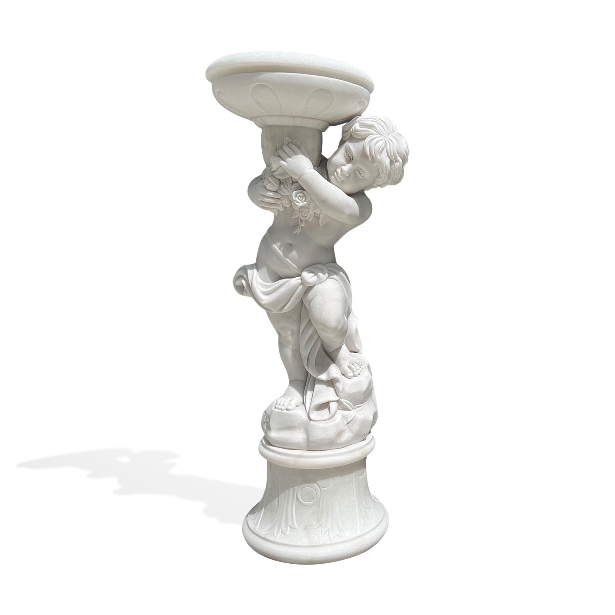white natural marble cherub flower planter statue displayed on lawn patio beside modern villa garden with blooming white flowers in planter bowl