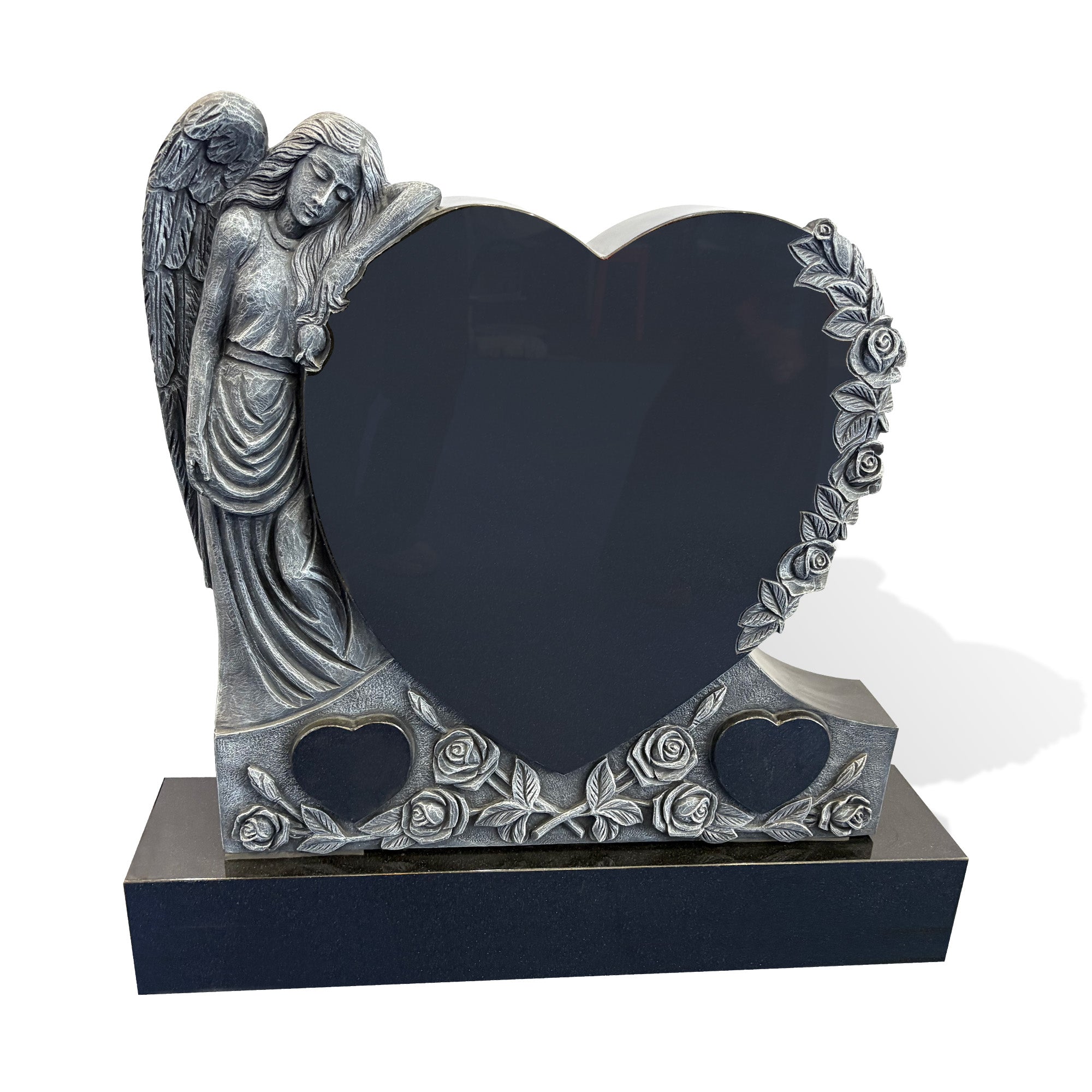 Front view of a black granite heart-shaped headstone with a resting angel, polished central memorial panel, matte carved leaves, and rose reliefs