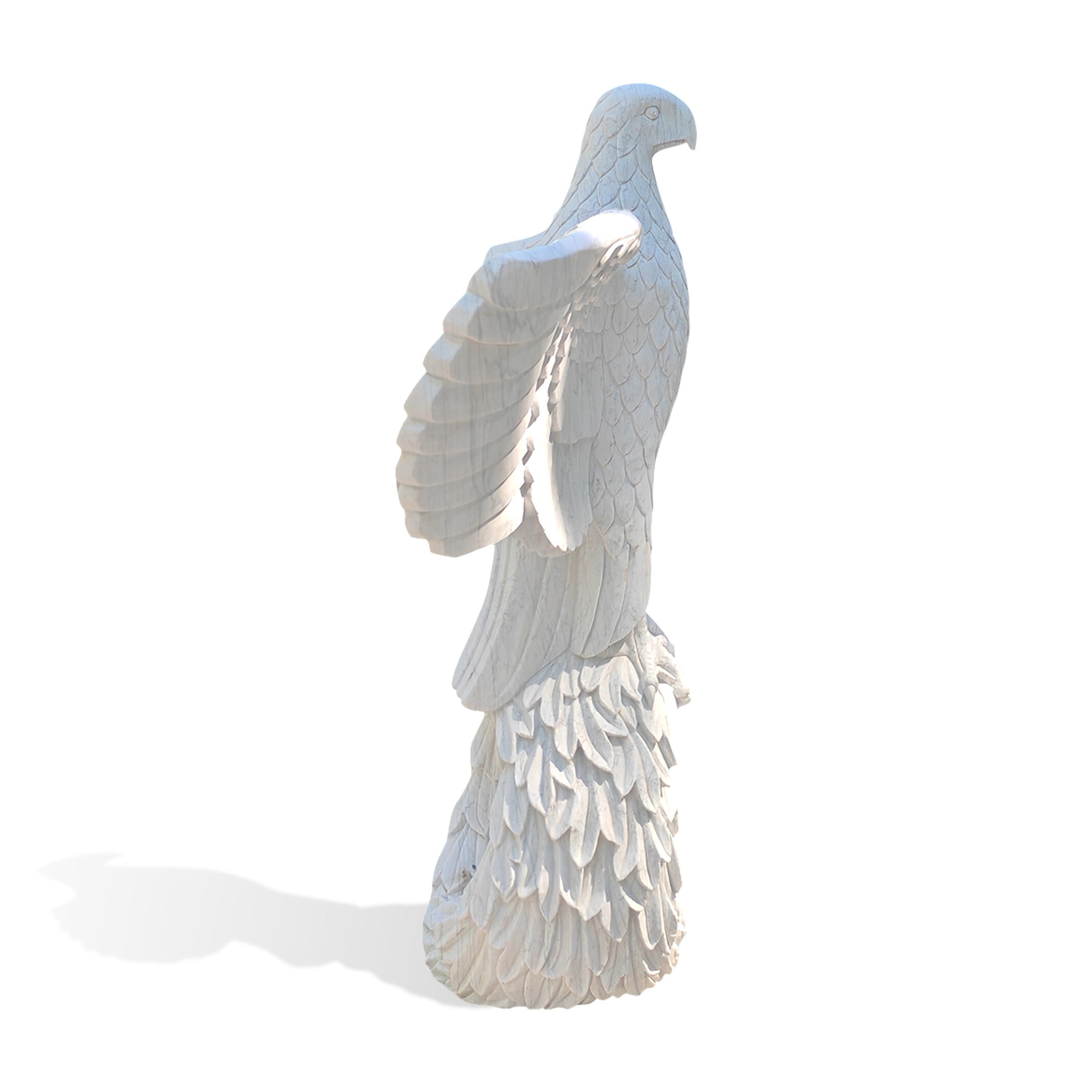 Side view of a hand-carved white marble eagle statue with layered feather details and spread wings