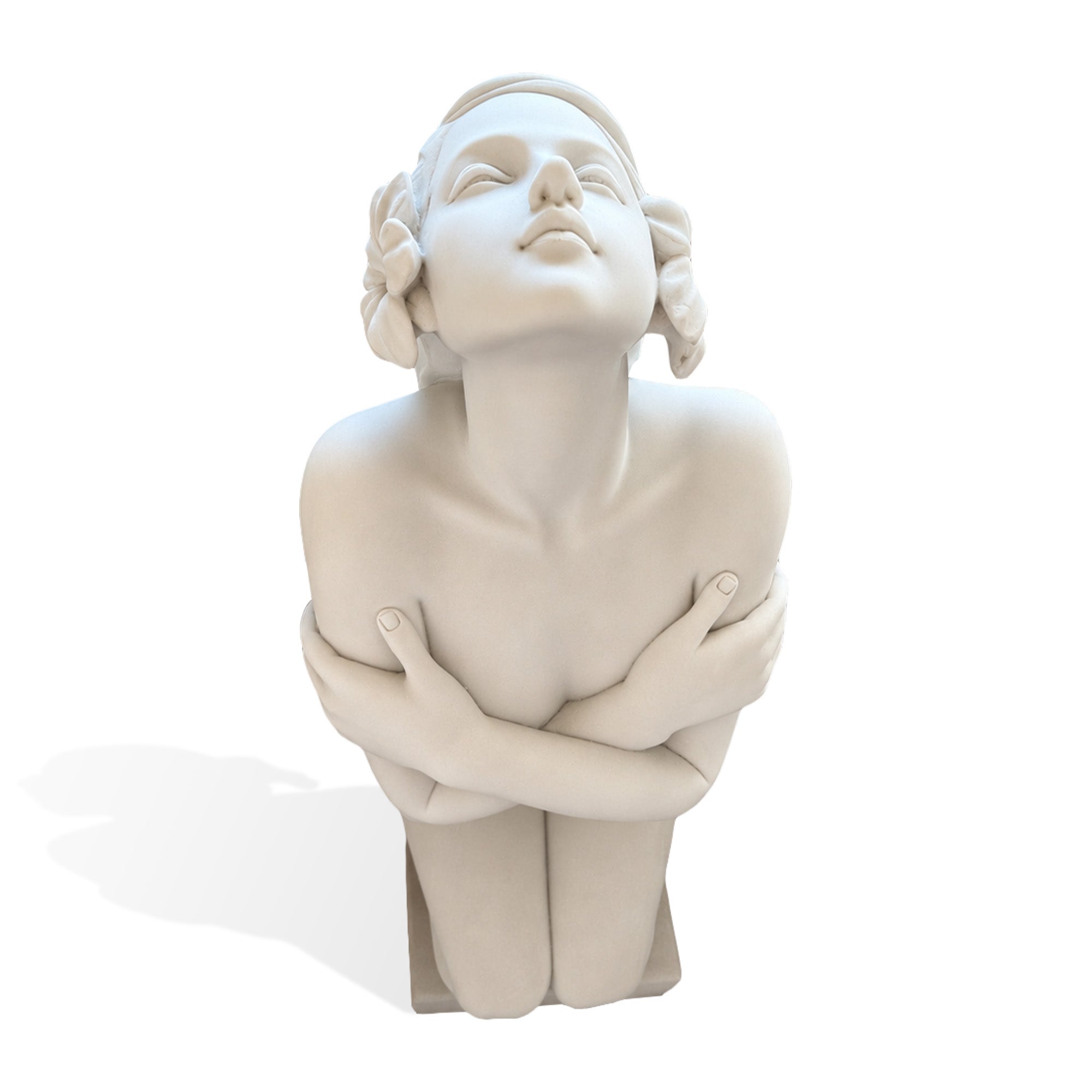 Close front view of a contemporary marble female figure statue with an upward gaze, crossed arms, and sculpted flower accents in her hair