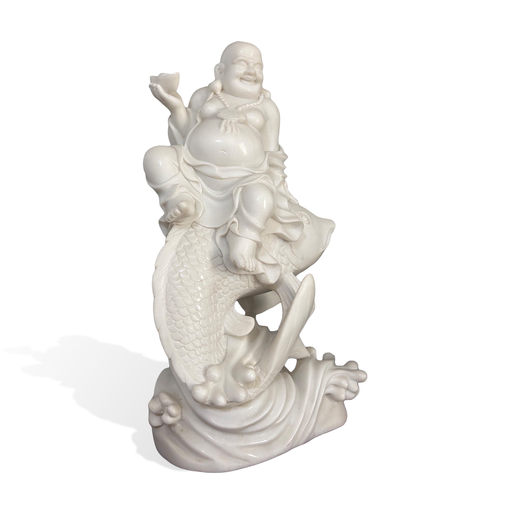 Side view of a hand-carved white marble Maitreya Buddha seated on a koi fish with detailed scales and flowing waves