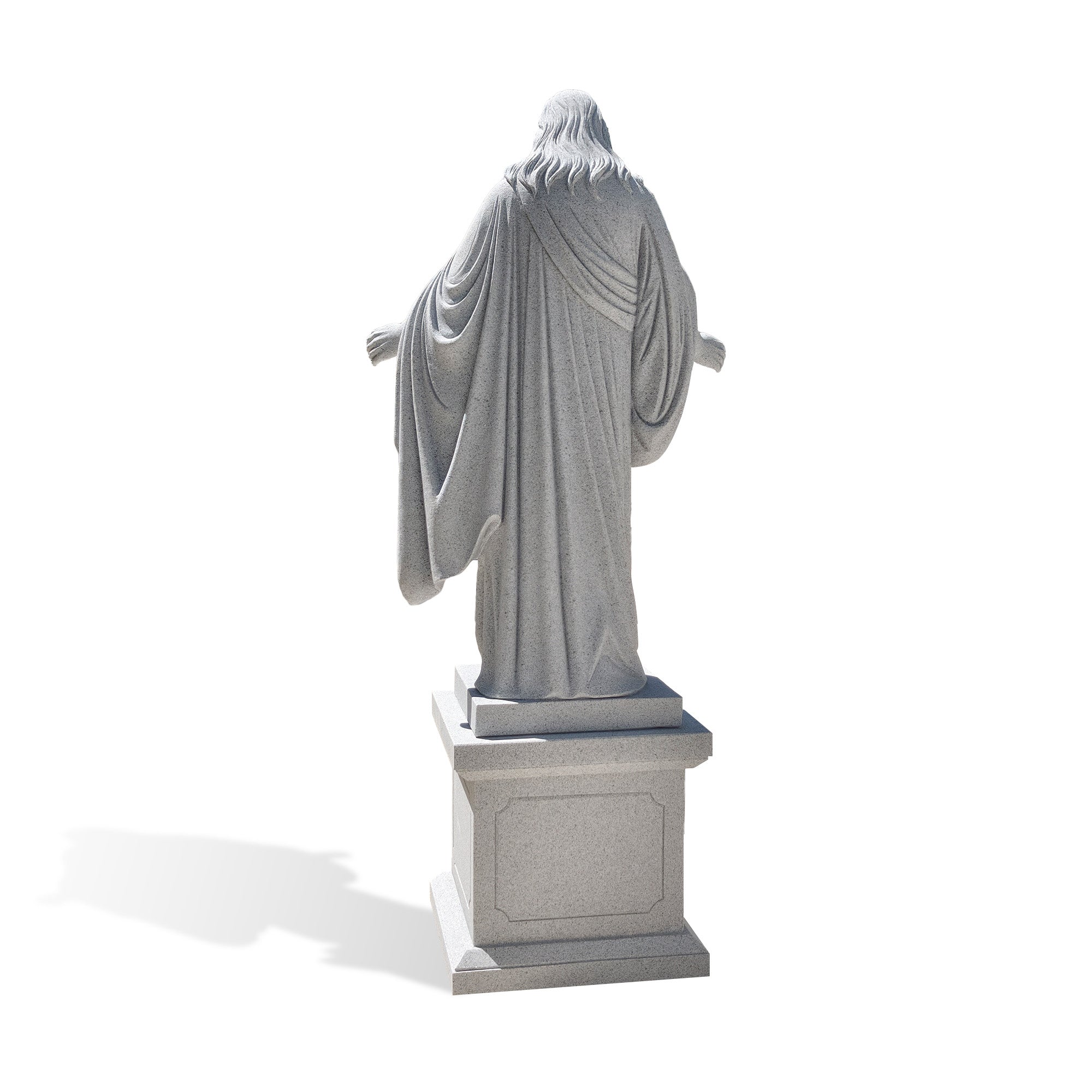 Back view of a natural grey granite Christ the Redeemer statue featuring flowing robes and detailed hand carving.