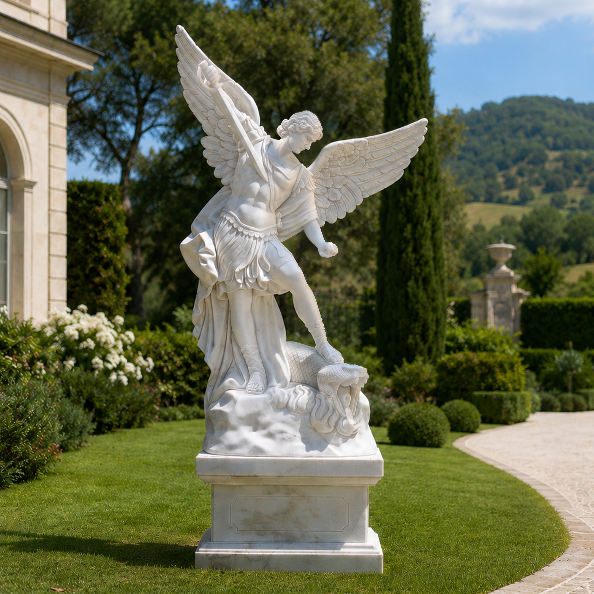 Saint Michael marble statue with open wings and raised sword displayed in an estate garden, symbolizing protection and victory over evil