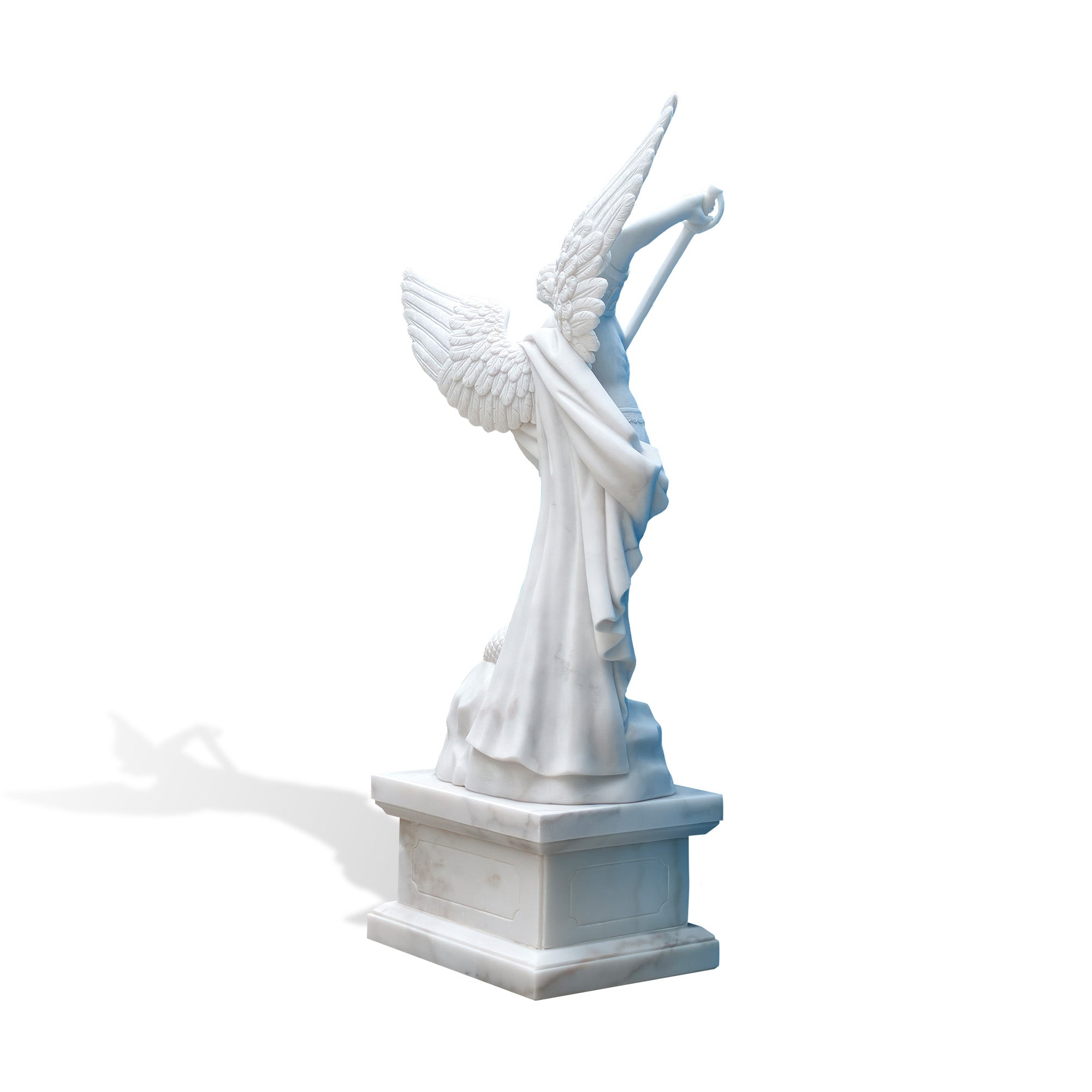 Rear side view of Saint Michael marble sculpture showing detailed wings, draped cloak, sword position, serpent detail, and pedestal base on white background