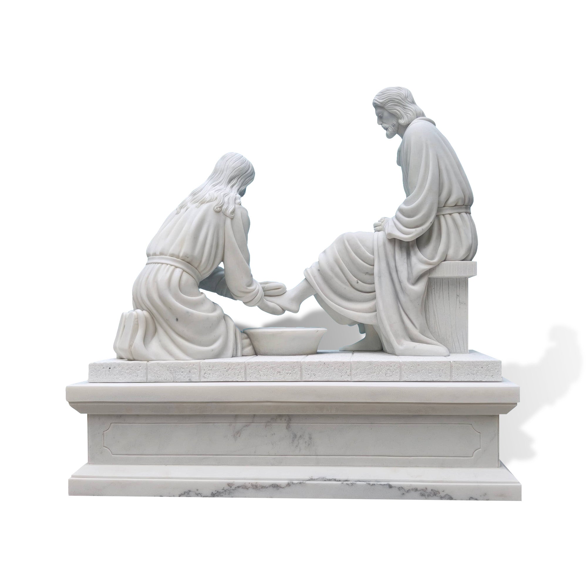 Back angle of marble Jesus washing feet sculpture showing seated Christ, kneeling disciple, water basin, pitcher, carved robes, and large pedestal base for church decor